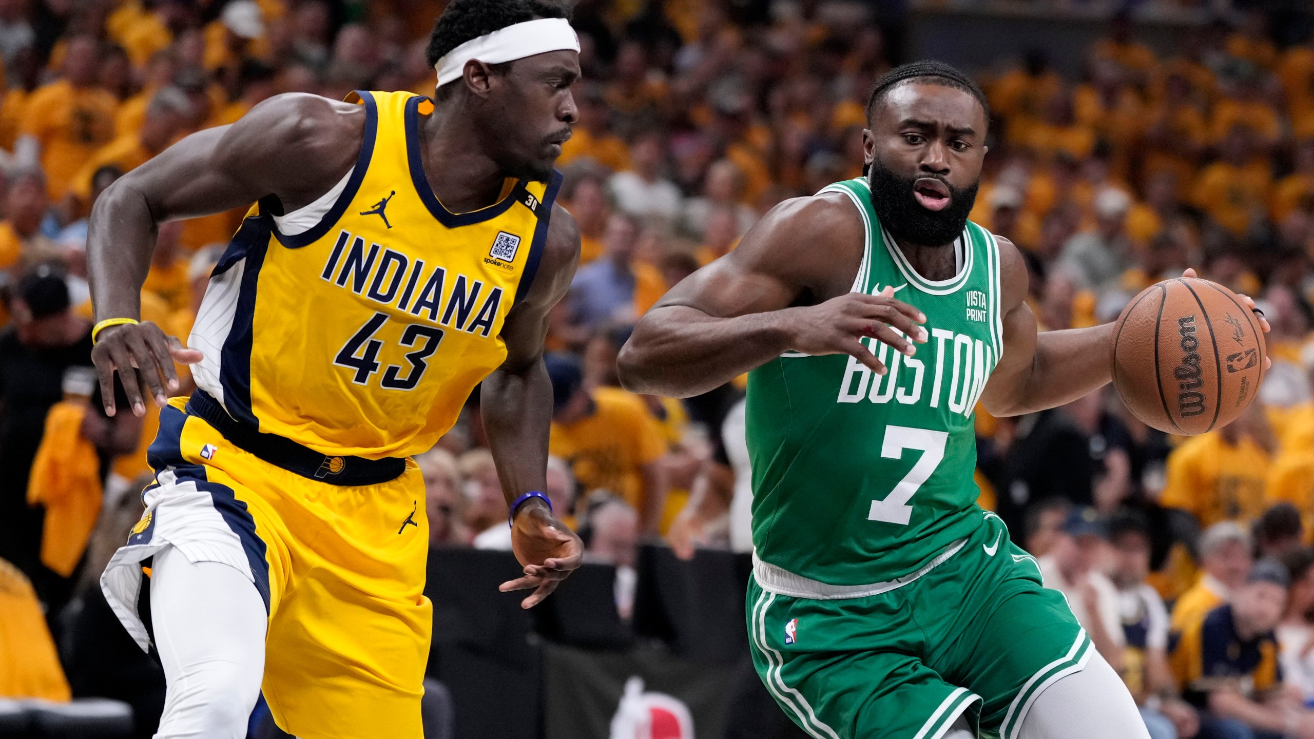 Boston Celtics guard Jaylen Brown (7) drives past Indiana Pacers forward Pascal Siakam (43) during the first half of Game 3 of the NBA Eastern Conference basketball finals, Saturday, May 25, 2024, in Indianapolis. (AP Photo/Michael Conroy)