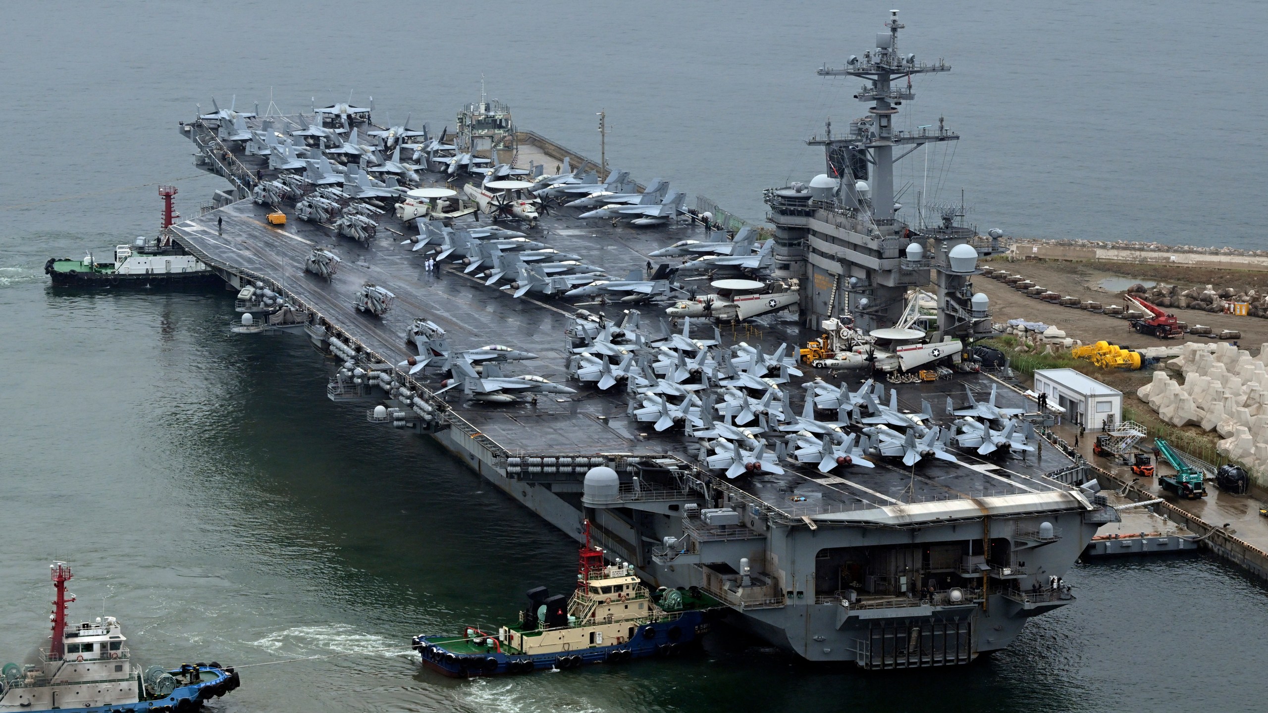 The Theodore Roosevelt (CVN 71), a nuclear-powered aircraft carrier is anchored in Busan, South Korea, Saturday, June 22, 2024. (Song Kyung-Seok/Pool Photo via AP)