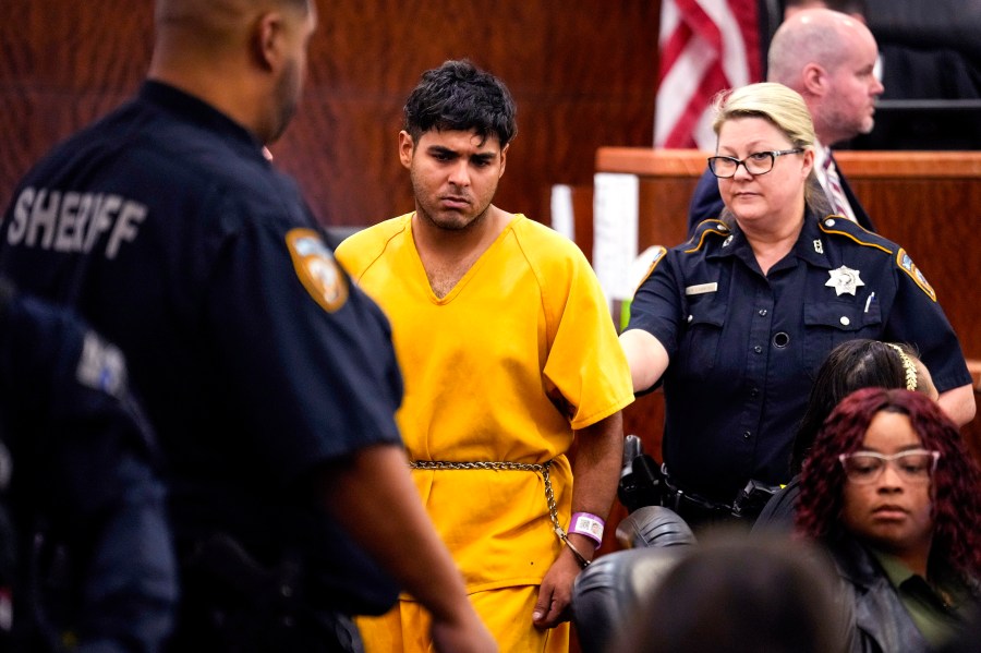 CORRECTS NAME: Johan Jose Martinez-Rangel, one of the two men accused of killing 12-year-old Jocelyn Nungaray, is led from the courtroom by deputies on Tuesday, June 25, 2024 in Houston. Capital murder charges have been filed against Martinez-Rangel and Franklin Jose Pena Ramos in the strangulation death of the 12-year-old. (Brett Coomer/Houston Chronicle via AP)