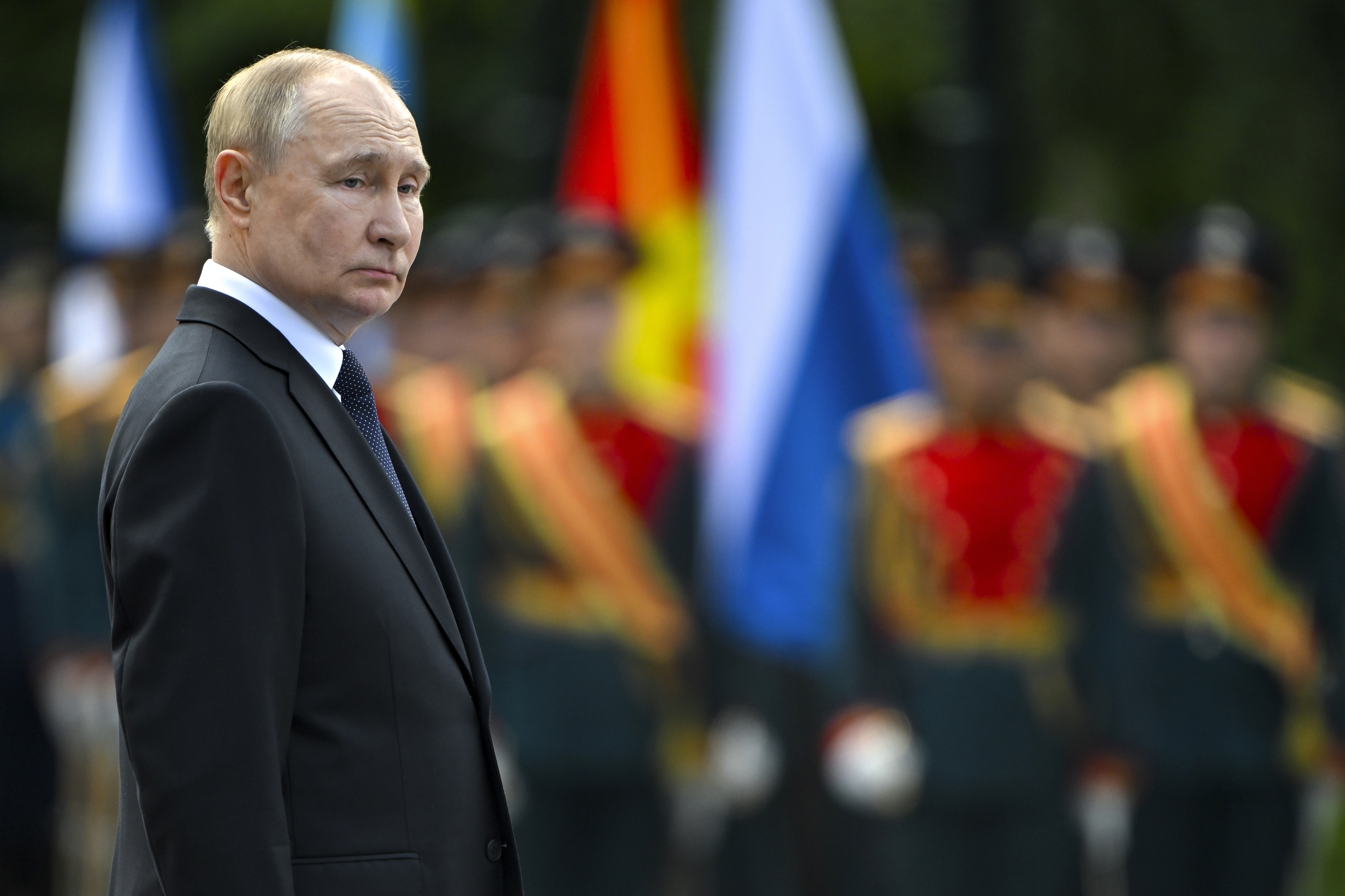 FILE - Russian President Vladimir Putin attends a wreath laying ceremony at the Tomb of Unknown Soldier near the Kremlin Wall in Moscow, Russia, on Saturday, June 22, 2024. Putin on Friday, June 28, 2024, called for resuming production of intermediate-range missiles that were banned under a now-scrapped treaty with the United States. (Sergei Guneyev, Sputnik, Kremlin Pool Photo via AP, File)