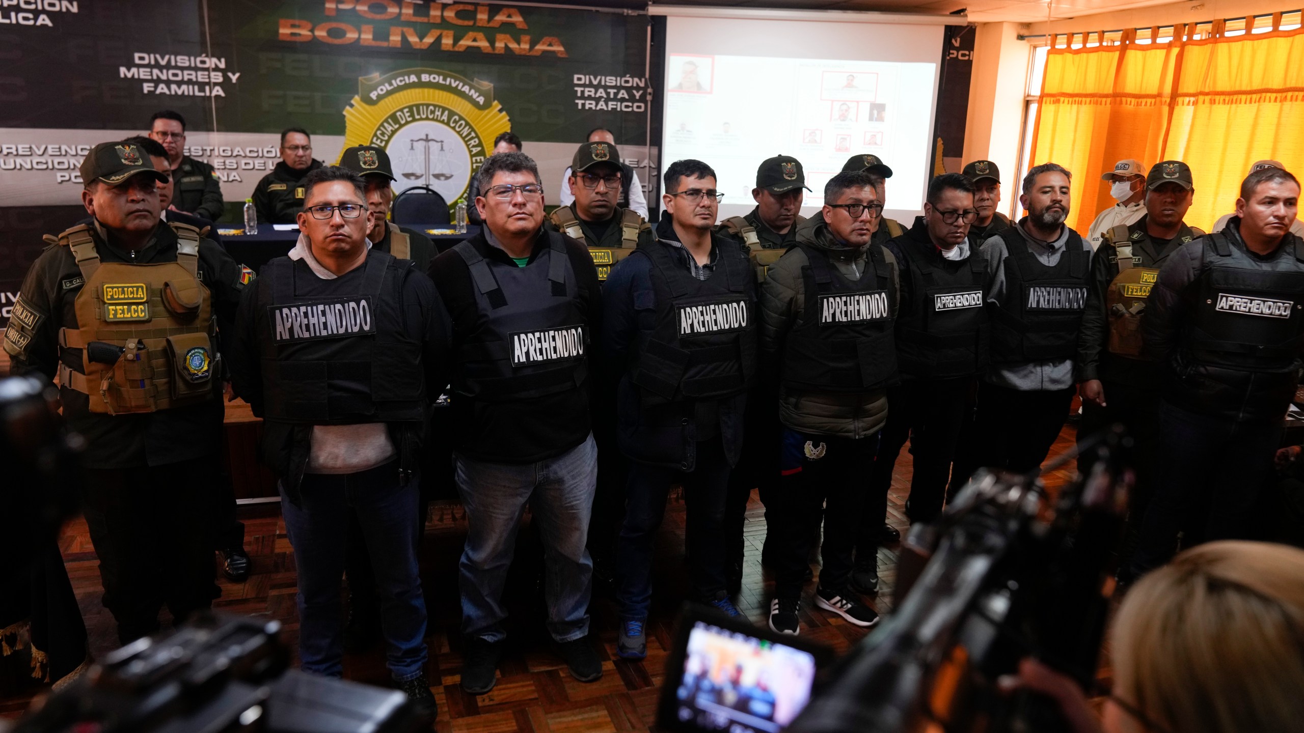 People arrested in connection with the previous day's uprising are presented by police to the press in La Paz, Bolivia, Thursday, June 27, 2024. The government announced more arrests over their alleged involvement in what President Luis Arce called a coup attempt. (AP Photo/Juan Karita)