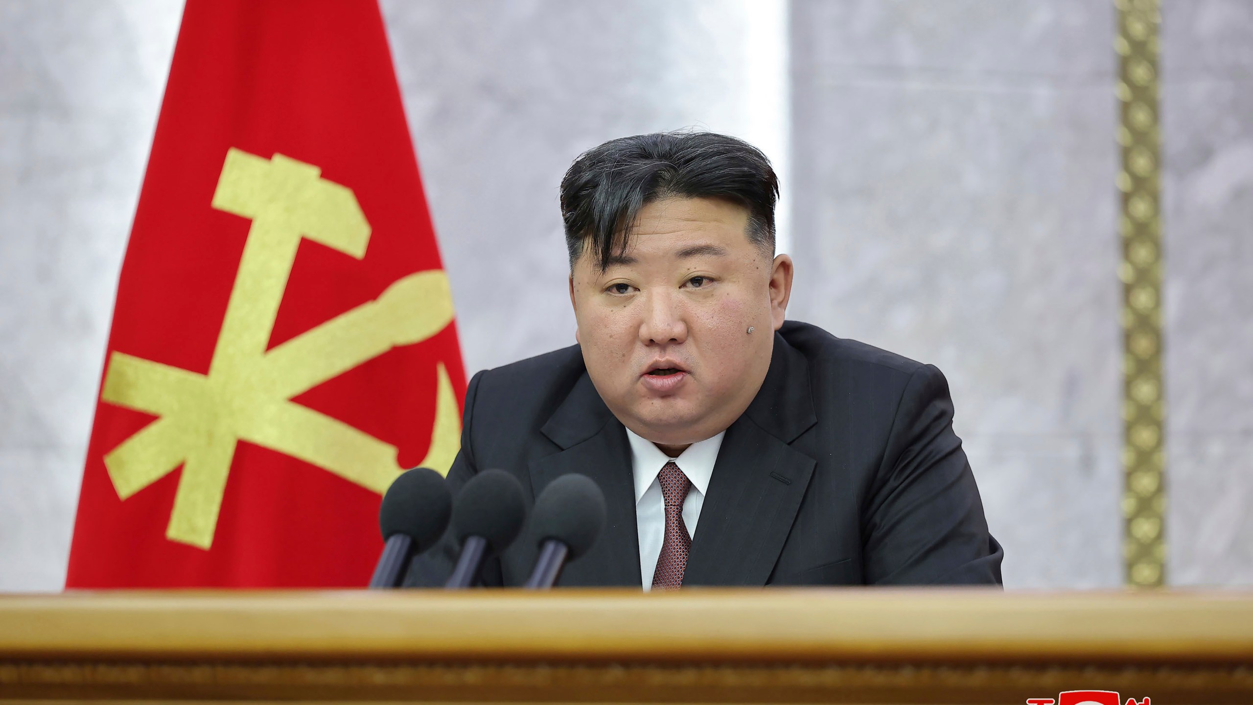 In this photo provided on Tuesday, July 2, 2024, by the North Korean government, North Korean leader Kim Jong Un delivers a speech during a meeting of Central Committee of the Workers' Party of Korea held from June 28 until July 1, in Pyongyang, North Korea. Independent journalists were not given access to cover the event depicted in this image distributed by the North Korean government. The content of this image is as provided and cannot be independently verified. Korean language watermark on image as provided by source reads: "KCNA" which is the abbreviation for Korean Central News Agency. (Korean Central News Agency/Korea News Service via AP)