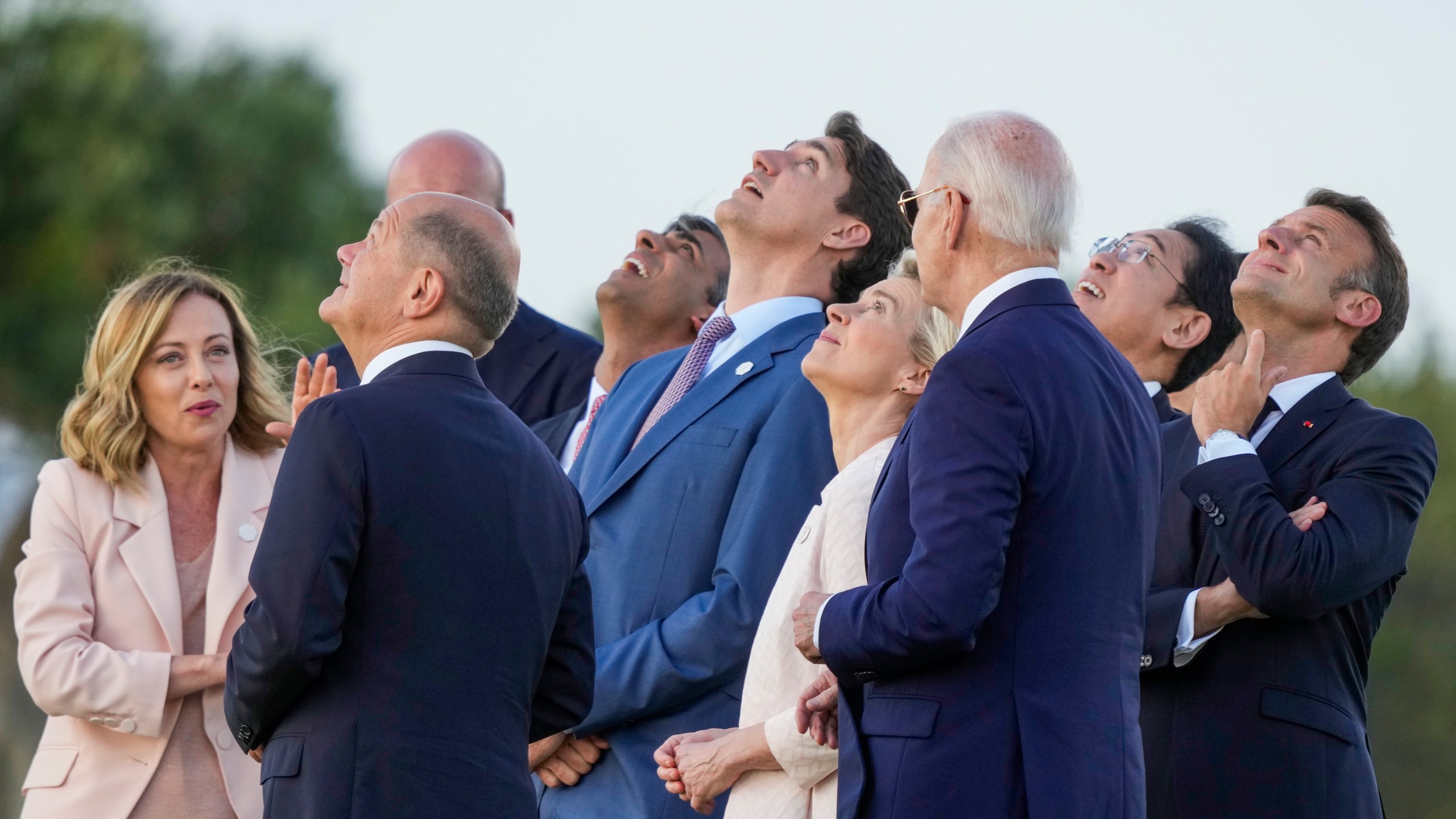 FILE - From right, French President Emmanuel Macron, Japan's Prime Minister Fumio Kishida, U.S. President Joe Biden, European Commission President Ursula von der Leyen, Canada's Prime Minister Justin Trudeau, Britain's Prime Minister Rishi Sunak, European Council President Charles Michel, German Chancellor Olaf Scholz and Italian Prime Minister Giorgia Meloni watch a skydiving demo during the G7 world leaders summit at Borgo Egnazia, Italy, Thursday, June 13, 2024. In France and Germany, the governments were weakened in elections this year. Italy is led by a prime minister whose party has neo-fascist roots, while an anti-immigrant party heads a shaky coalition in the Netherlands and Spain's Cabinet relies on small parties to rule. (AP Photo/Luca Bruno, File)