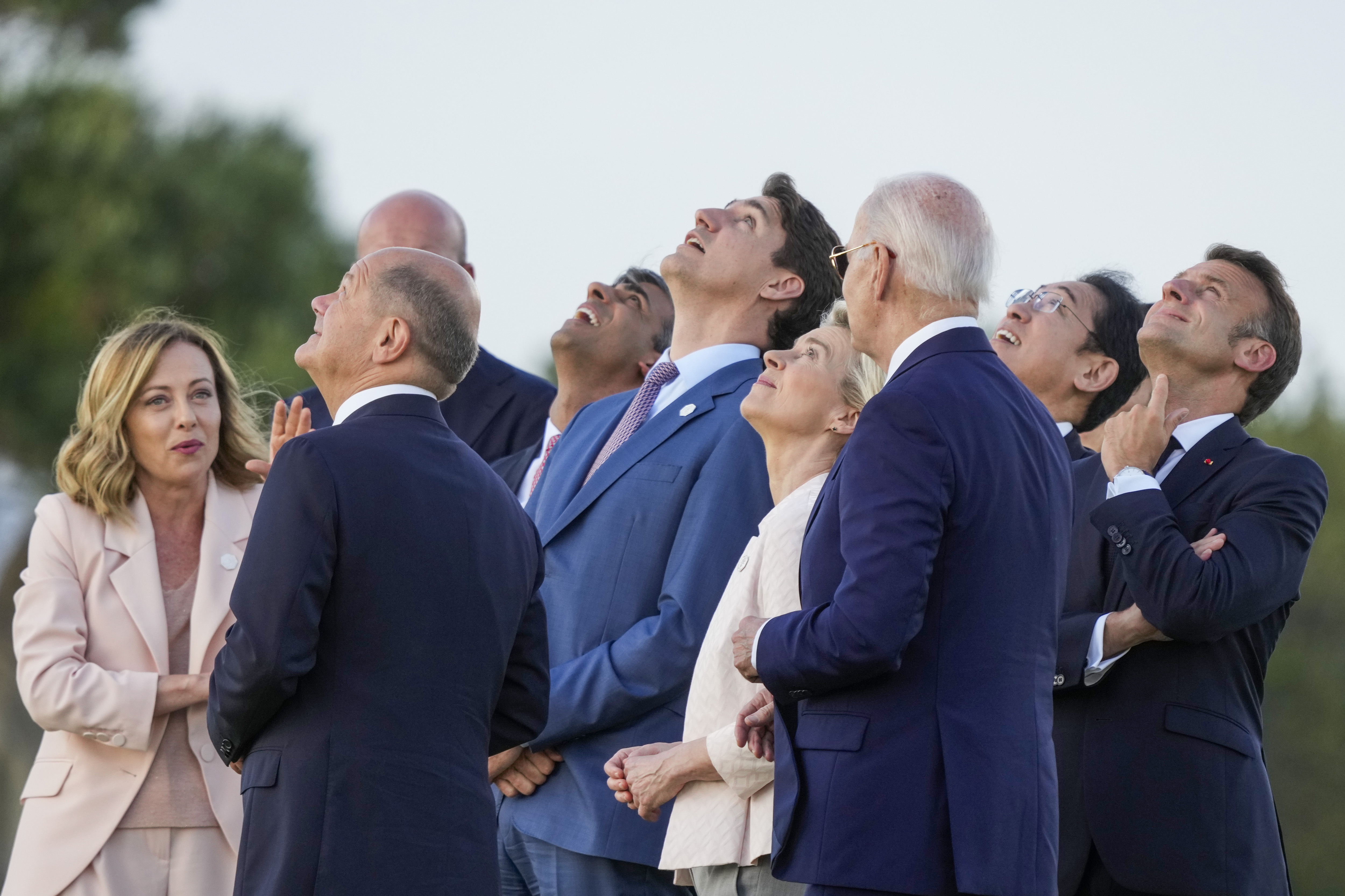 FILE - From right, French President Emmanuel Macron, Japan's Prime Minister Fumio Kishida, U.S. President Joe Biden, European Commission President Ursula von der Leyen, Canada's Prime Minister Justin Trudeau, Britain's Prime Minister Rishi Sunak, European Council President Charles Michel, German Chancellor Olaf Scholz and Italian Prime Minister Giorgia Meloni watch a skydiving demo during the G7 world leaders summit at Borgo Egnazia, Italy, Thursday, June 13, 2024. In France and Germany, the governments were weakened in elections this year. Italy is led by a prime minister whose party has neo-fascist roots, while an anti-immigrant party heads a shaky coalition in the Netherlands and Spain's Cabinet relies on small parties to rule. (AP Photo/Luca Bruno, File)