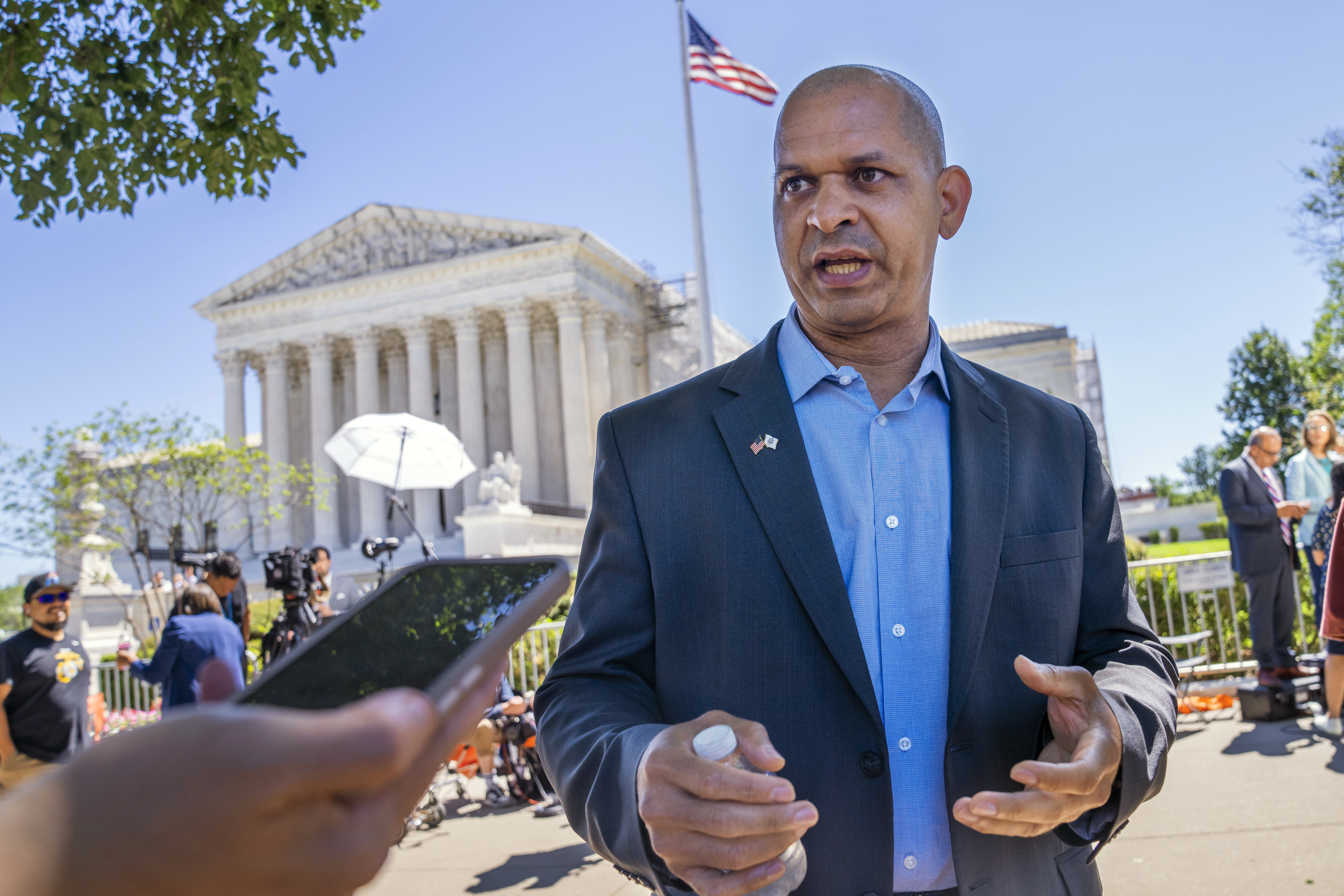 FILE - Former U.S. Capitol Police Sgt. Aquilino Gonell, who defended the Capitol on Jan. 6, is interviewed outside of the Supreme Court, July 1, 2024, after the court decision o the immunity case of former President Donald Trump, in Washington. (AP Photo/Jacquelyn Martin, File)