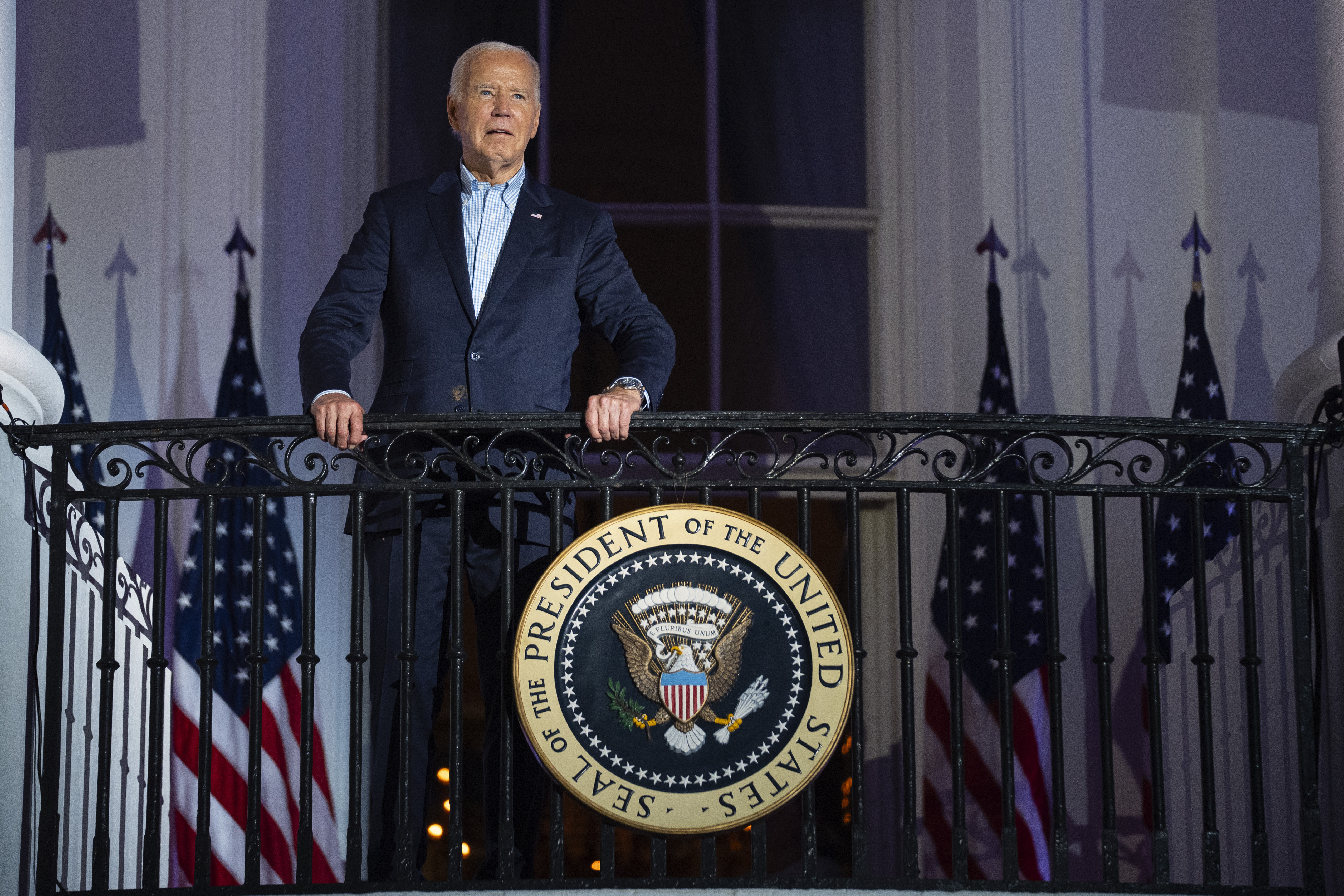 President Joe Biden waits for the start of the Independence Day firework display over the National Mall from the balcony of the White House, Thursday, July 4, 2024, in Washington. (AP Photo/Evan Vucci)
