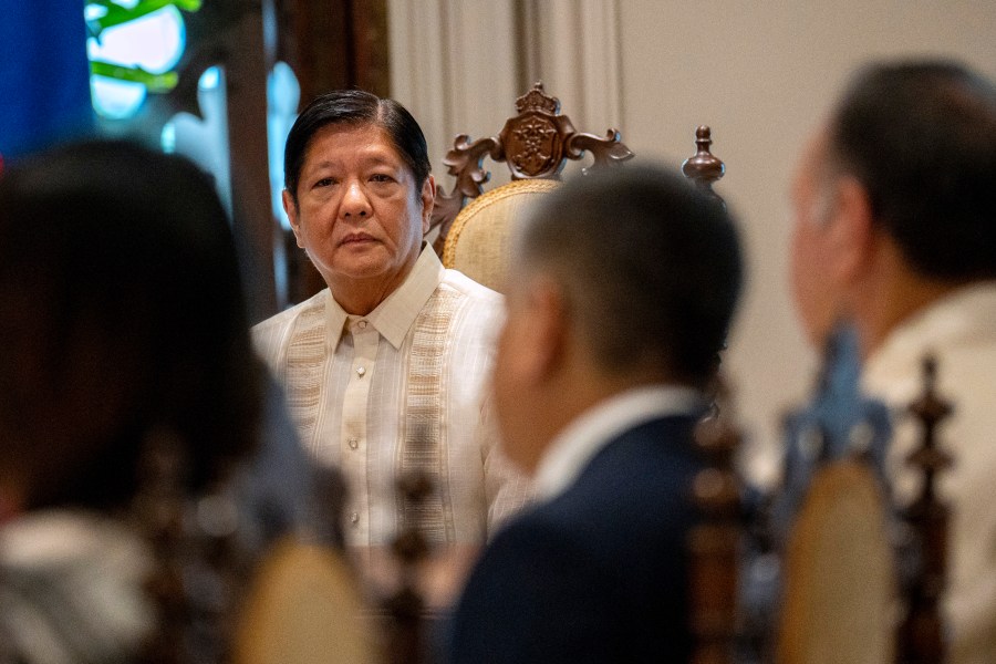 Philippine President Ferdinand Marcos Jr. looks on during a courtesy call visit of Japan Foreign Minister Yoko Kamikawa and Japan Defence Minister Minoru Kihara, at the Malacanang Palace in Manila, Philippines, Monday, July 8, 2024. (Lisa Marie David/Pool Photo via AP)