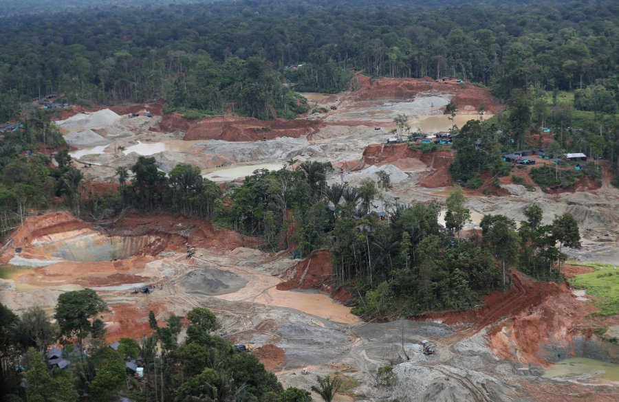 FILE - An illegal gold mining operation that contributed to deforestation is visible in Magui Payan, Colombia, April 20, 2021. The mine was among targets for destruction by National Police and soldiers in a crackdown against mining. Deforestation in Colombia fell 36% in 2023 versus the previous year, the government said in a press conference on Monday, July 8, 2024, marking the lowest level since records began. (AP Photo/Fernando Vergara, File)