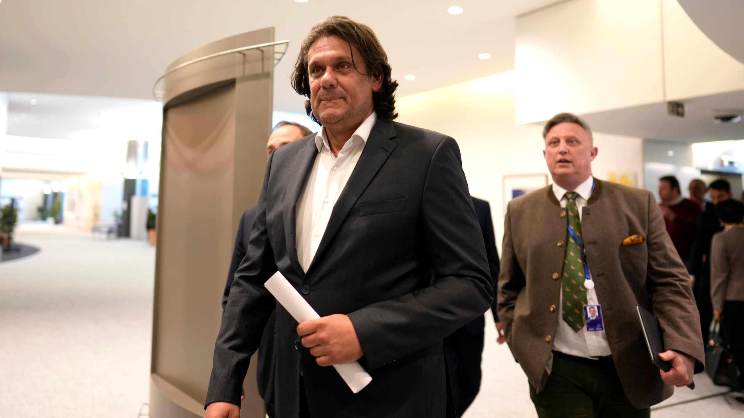 Hungarian politician Tamas Deutsch arrives for a meeting at the European Parliament in Brussels, Monday, July 8, 2024. Senior officials of right-wing parties from Hungary and France met with allies from Austria, Belgium, the Czech Republic, the Netherlands, Portugal and Spain to discuss the formation of a new political group in the European Parliament, the Patriots of Europe. (AP Photo/Virginia Mayo)