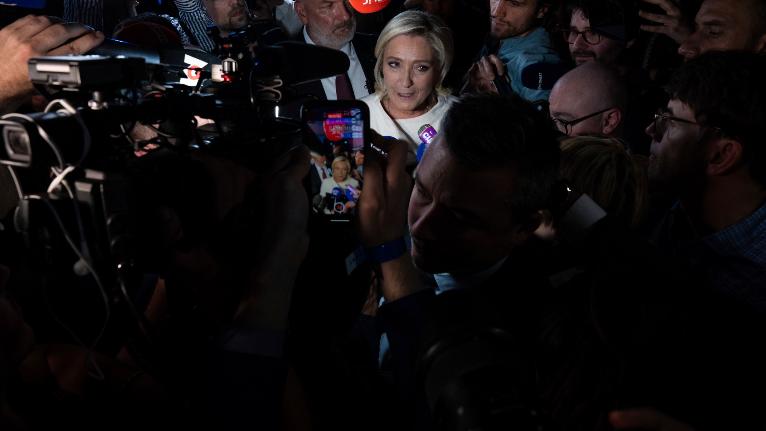 Far-right National Rally party leader Marine Le Pen answers reporters after the second round of the legislative election, Sunday, July 7, 2024, at the party election night headquarters in Paris. A coalition on the left that came together unexpectedly ahead of France's snap elections won the most parliamentary seats in the vote, according to polling projections Sunday. The surprise projections put President Emmanuel Macron's centrist alliance in second and the far right in third. (AP Photo/Louise Delmotte)