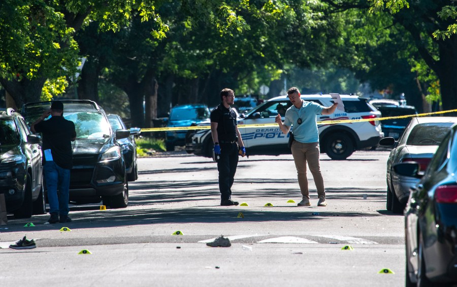 Detroit police investigate the scene of a shooting that happened early Sunday, July 7, 2024, in Detroit. (John T. Greilick/Detroit News via AP)