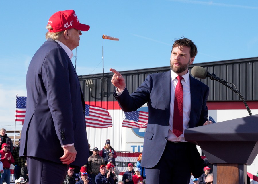 FILE - Sen. J.D. Vance, R-Ohio, right, points toward Republican presidential candidate former President Donald Trump at a campaign rally, March 16, 2024, in Vandalia, Ohio. Vance is a top contender to be selected as Trump's running mate. (AP Photo/Jeff Dean, File)