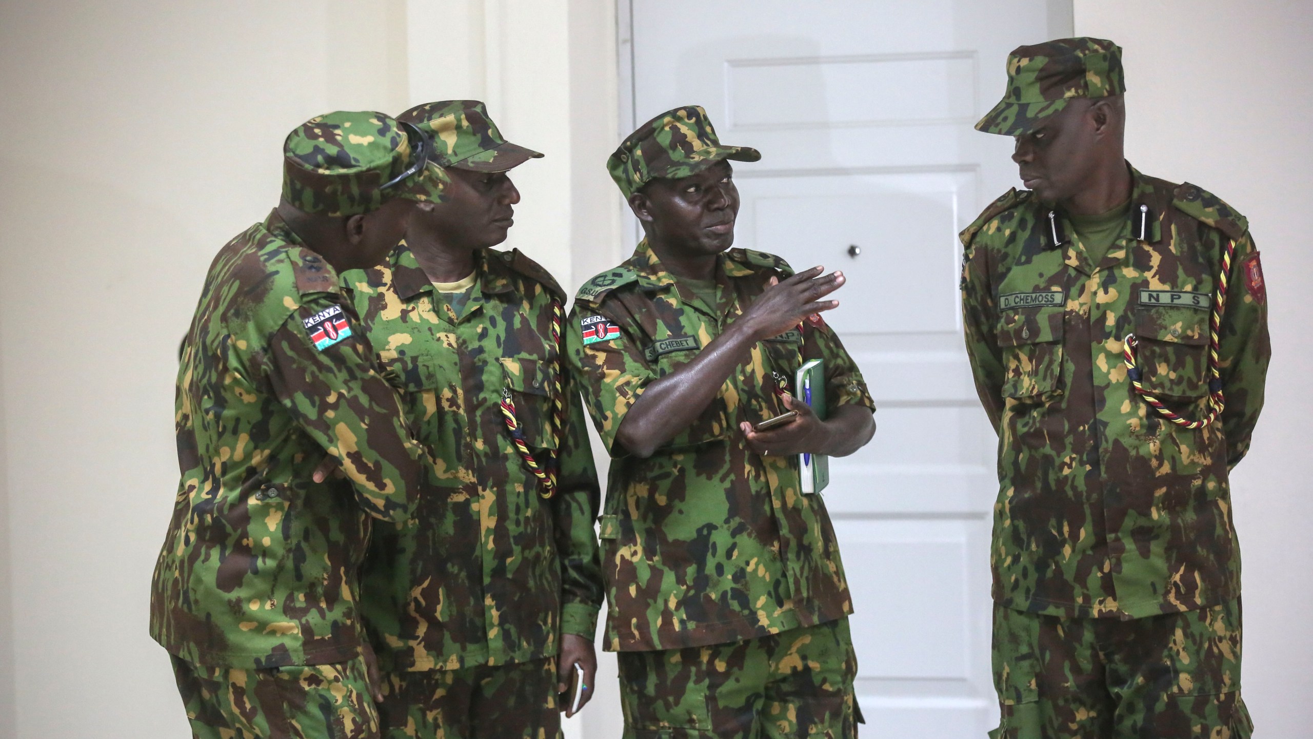 Members of a UN-backed Kenyan police stand at the police headquarters ahead of a press conference in Port-au-Prince, Haiti, Monday, July 8, 2024. (AP Photo/Odelyn Joseph)