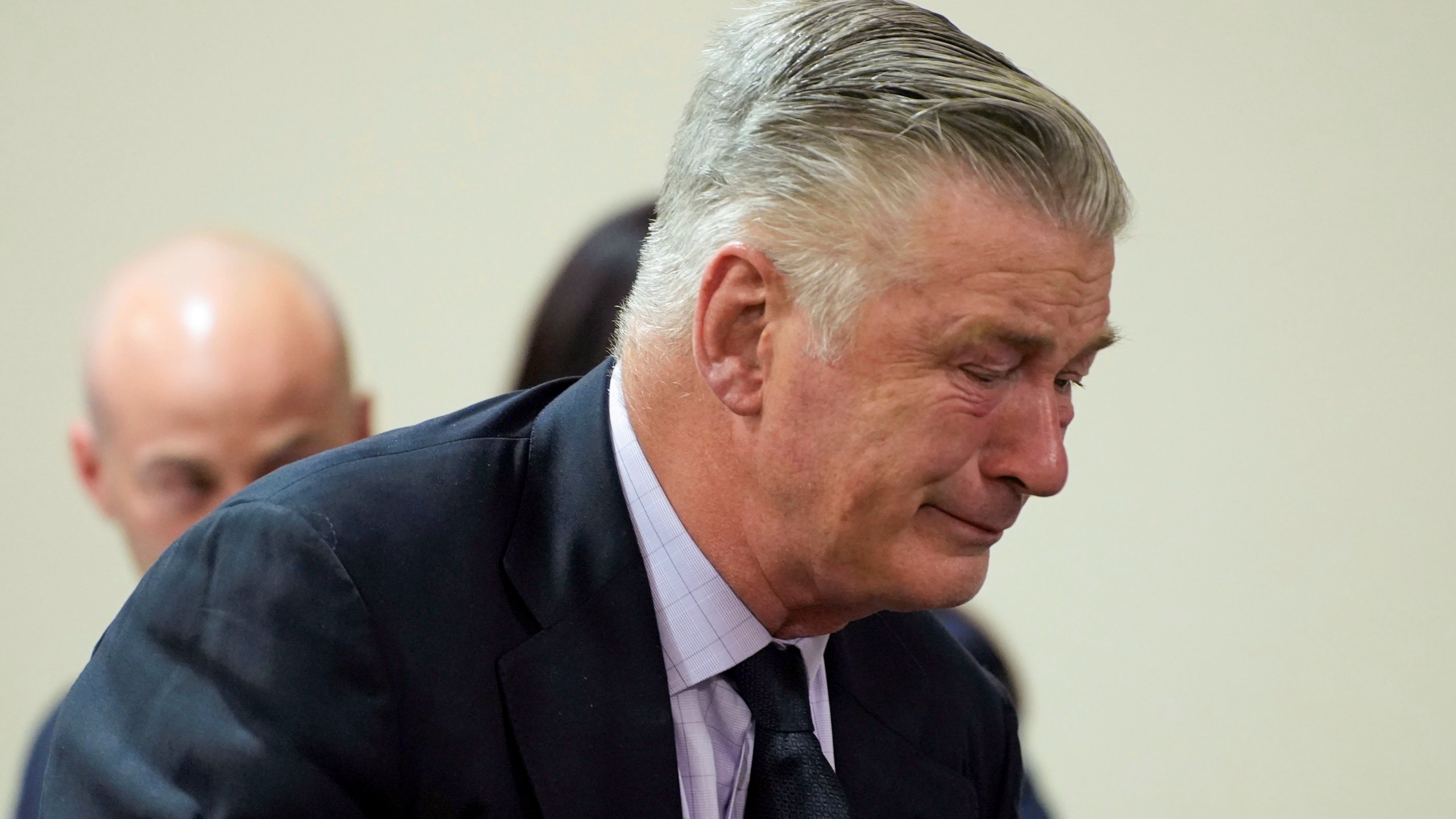Actor Alec Baldwin reacts during his trial for involuntary manslaughter for the 2021 fatal shooting of cinematographer Halyna Hutchins during filming of the Western movie "Rust," Friday, July 12, 2024, at Santa Fe County District Court in Santa Fe, N.M. The judge threw out the case against Baldwin in the middle of his trial and said it cannot be filed again. (Ramsay de Give/Pool Photo via AP)