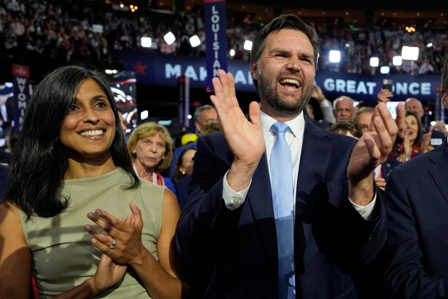 Republican vice presidential candidate Sen. JD Vance, R-Ohio, and his wife Usha Chilukuri Vance arrive on the floor during the first day of the 2024 Republican National Convention at the Fiserv Forum, Monday, July 15, 2024, in Milwaukee. (AP Photo/Carolyn Kaster)