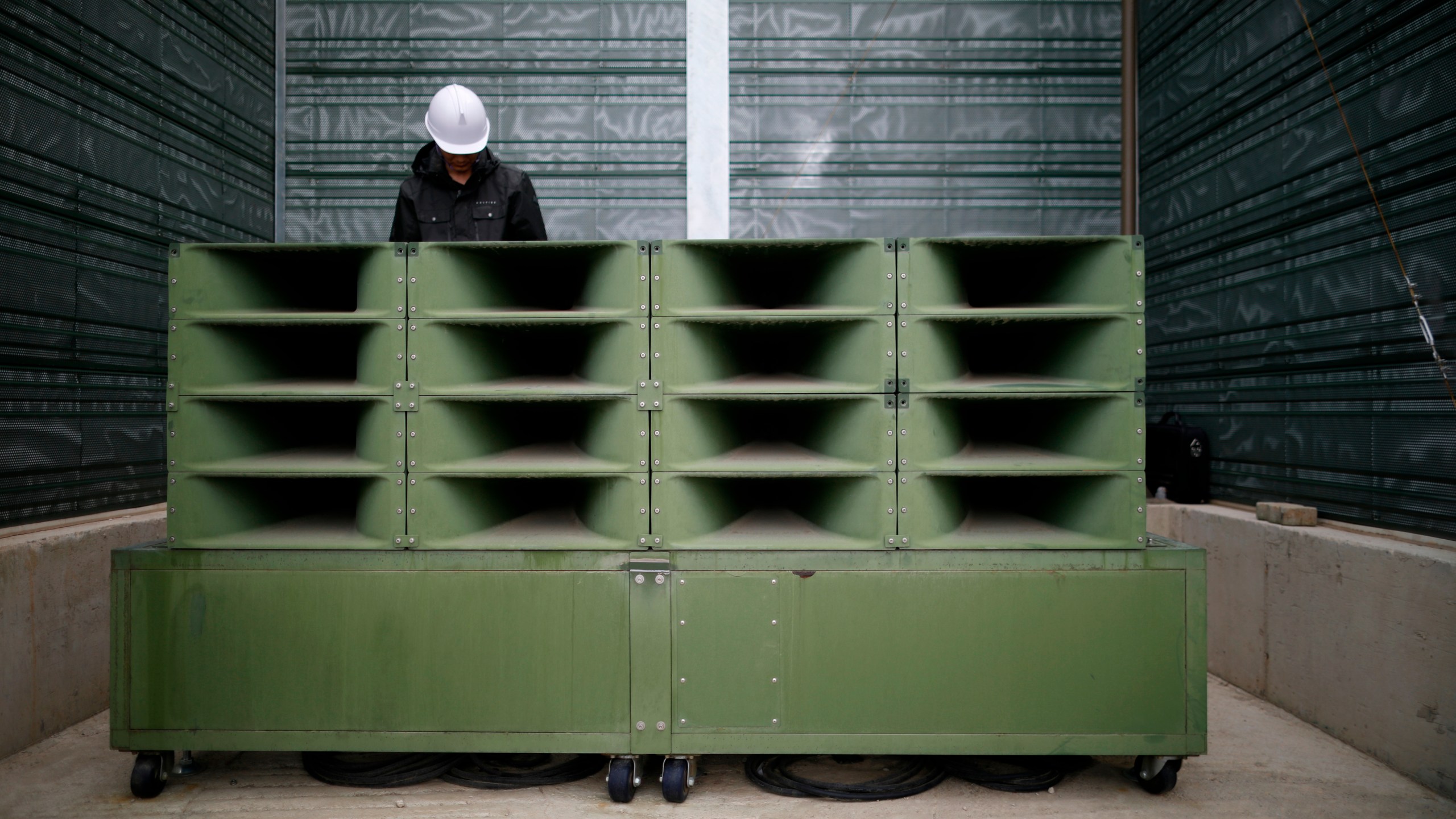 FILE - A worker dismantles loudspeakers that set up for propaganda broadcasts near the demilitarized zone separating the two Koreas in Paju, South Korea, on May 1, 2018. South Korea said Friday, July 19, 2024, it has restarted anti-Pyongyang propaganda broadcasts across the border in response to North Korea’s resumption of trash-carrying balloon launches. (Kim Hong-Ji/Pool Photo via AP, File)