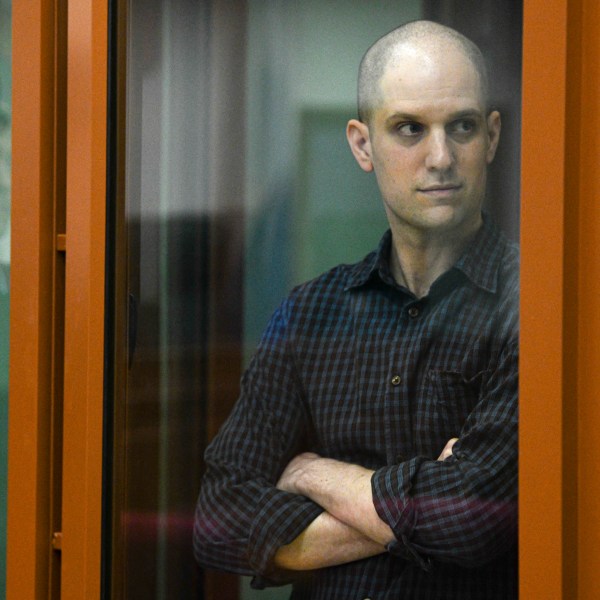 FILE - Wall Street Journal reporter Evan Gershkovich stands in a glass cage in a courtroom in Yekaterinburg, Russia, Wednesday, June 26, 2024. Court officials say closing arguments in the espionage trial of U.S. journalist Evan Gershkovich will be held Friday, July 19, 2024, as the proceedings picked up speed in a case that has seen the reporter held in pre-trial custody for over a year. (AP Photo, File)