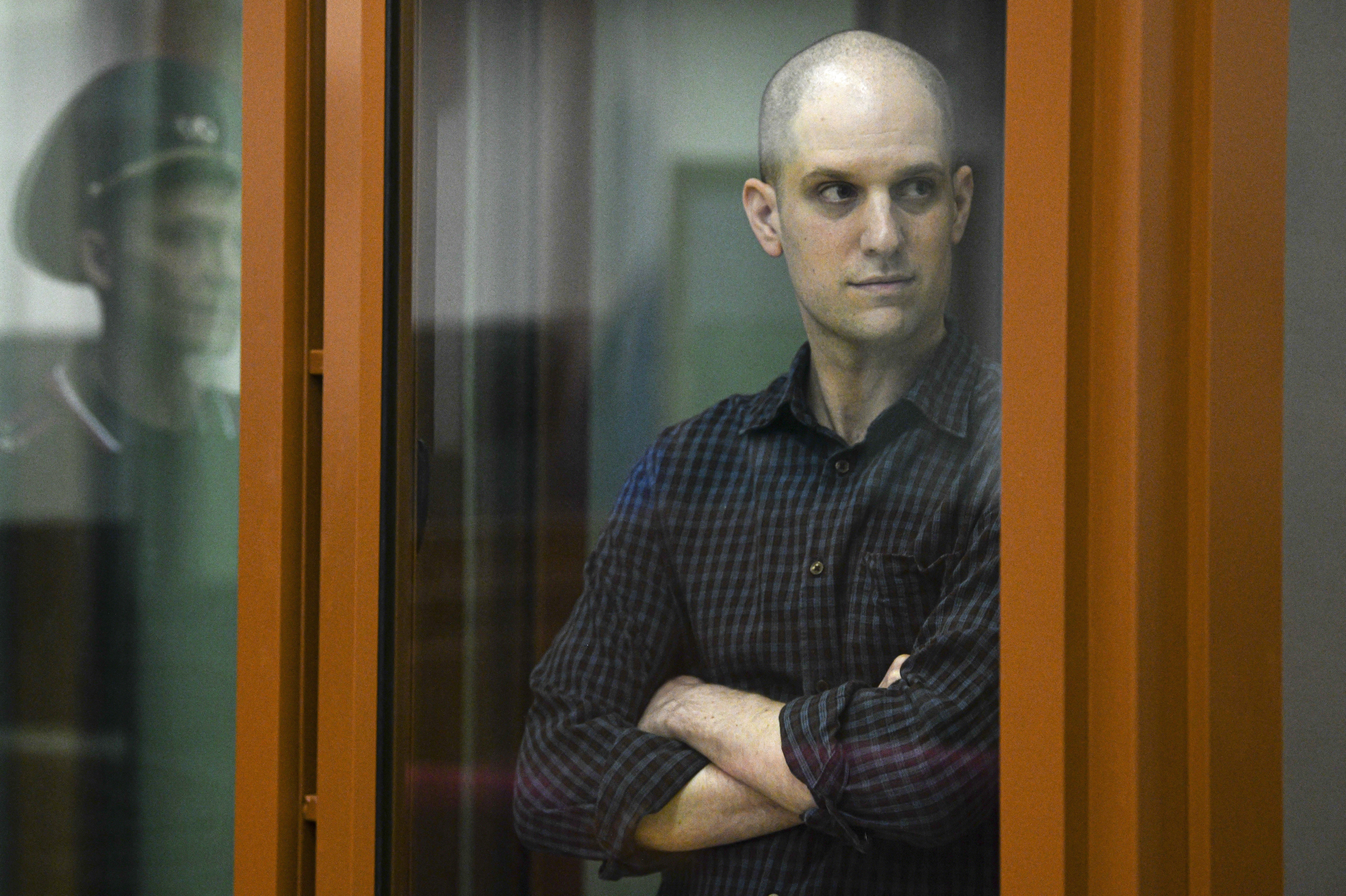 FILE - Wall Street Journal reporter Evan Gershkovich stands in a glass cage in a courtroom in Yekaterinburg, Russia, Wednesday, June 26, 2024. Court officials say closing arguments in the espionage trial of U.S. journalist Evan Gershkovich will be held Friday, July 19, 2024, as the proceedings picked up speed in a case that has seen the reporter held in pre-trial custody for over a year. (AP Photo, File)