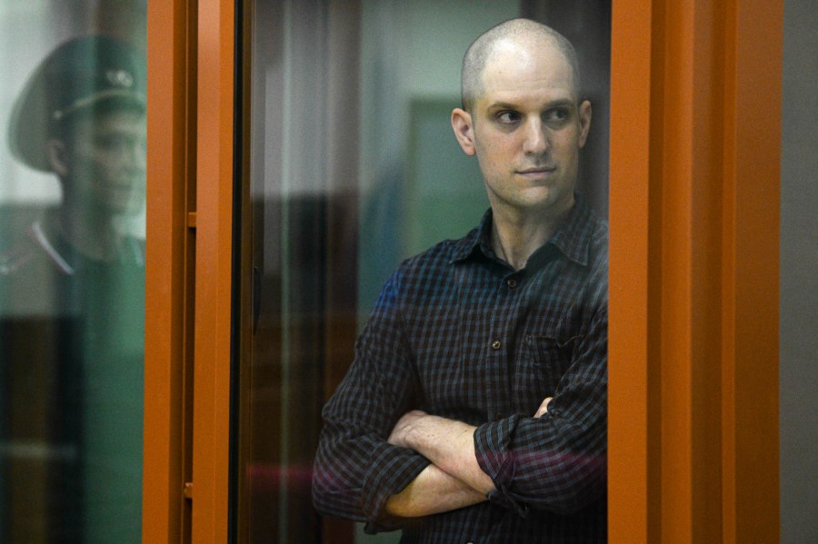 FILE - Wall Street Journal reporter Evan Gershkovich stands in a glass cage in a courtroom in Yekaterinburg, Russia, Wednesday, June 26, 2024. Court officials say closing arguments in the espionage trial of U.S. journalist Evan Gershkovich will be held Friday, July 19, 2024, as the proceedings picked up speed in a case that has seen the reporter held in pre-trial custody for over a year. (AP Photo, File)