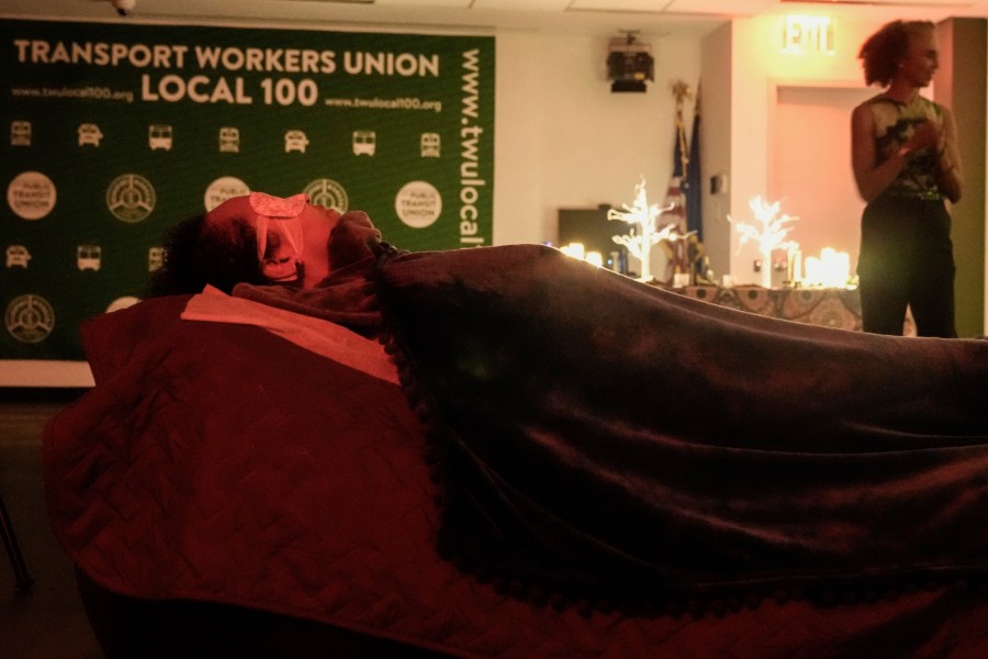 Transit Workers take part in a guided relaxation class Friday, May 17, 2024, in the Brooklyn borough of New York. The class, held at a union hall for New York City transit employees, has emerged as one of several ways in which transportation workers around the country are trying to manage their fear and anxiety over a rise in violent crime on subways and buses. (AP Photo/Frank Franklin II)