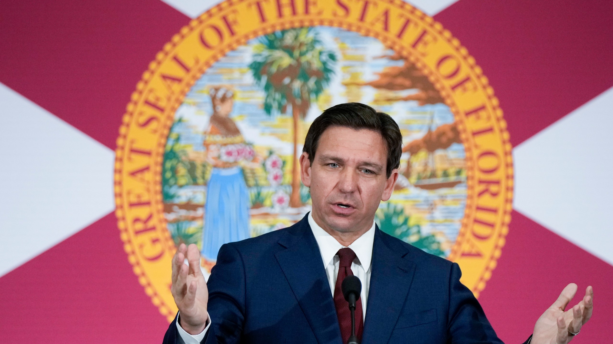 FILE - Florida Gov. Ron DeSantis speaks during a news conference in Miami, on May 9, 2023. The Treasury Department is warning that state laws that restrict banks from considering environmental, social and governance factors could harm efforts to address money laundering and terrorism financing. The Associated Press obtained a copy of a letter sent Thursday to lawmakers. The letter single out a law signed by Florida Gov. Ron DeSantis in May that says it would be an “unsafe and unsound practice” for banks to consider non-financial factors when doing business. (AP Photo/Rebecca Blackwell, File)