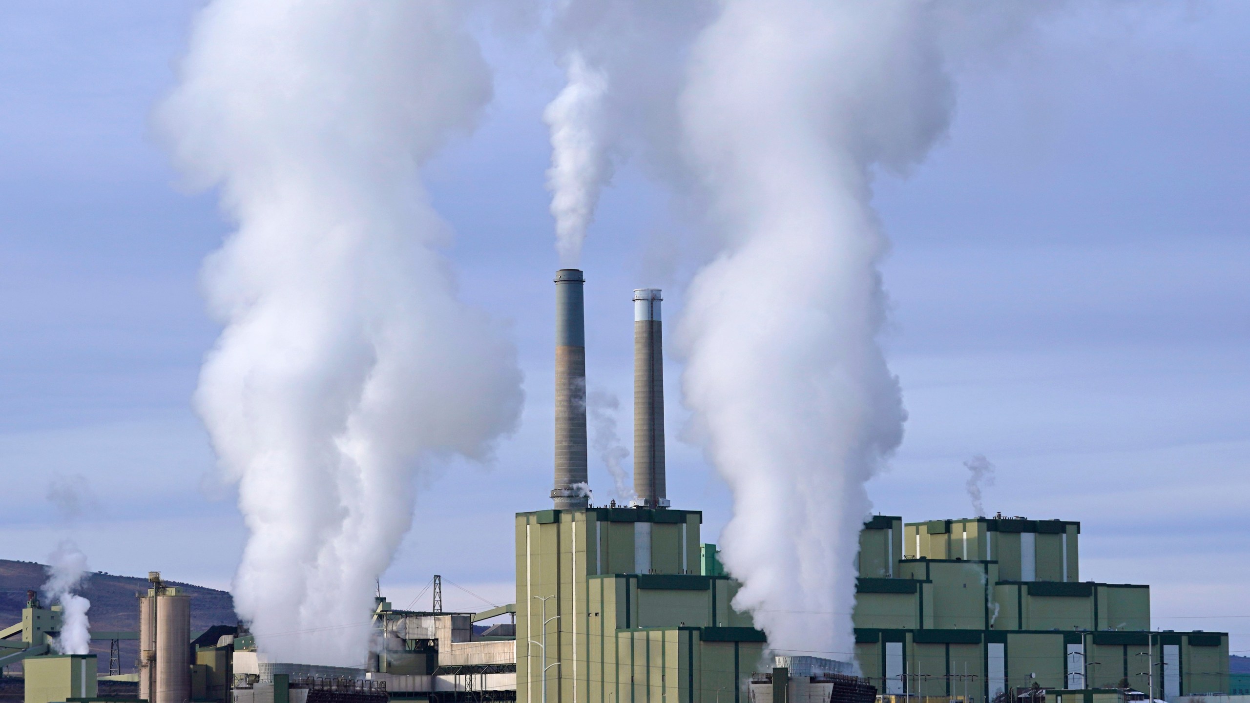 FILE - Steam billows from a coal-fired power plant Nov. 18, 2021, in Craig, Colo. A federal appeals court on Friday, July 19, 2024, allowed a Biden administration rule aimed at limiting planet-warming pollution from coal-fired power plants to remain in place, even as legal challenges continue. The EPA rule, announced in April, would force many coal-fired power plants to capture 90% of their carbon emissions or shut down within eight years. (AP Photo/Rick Bowmer, File)