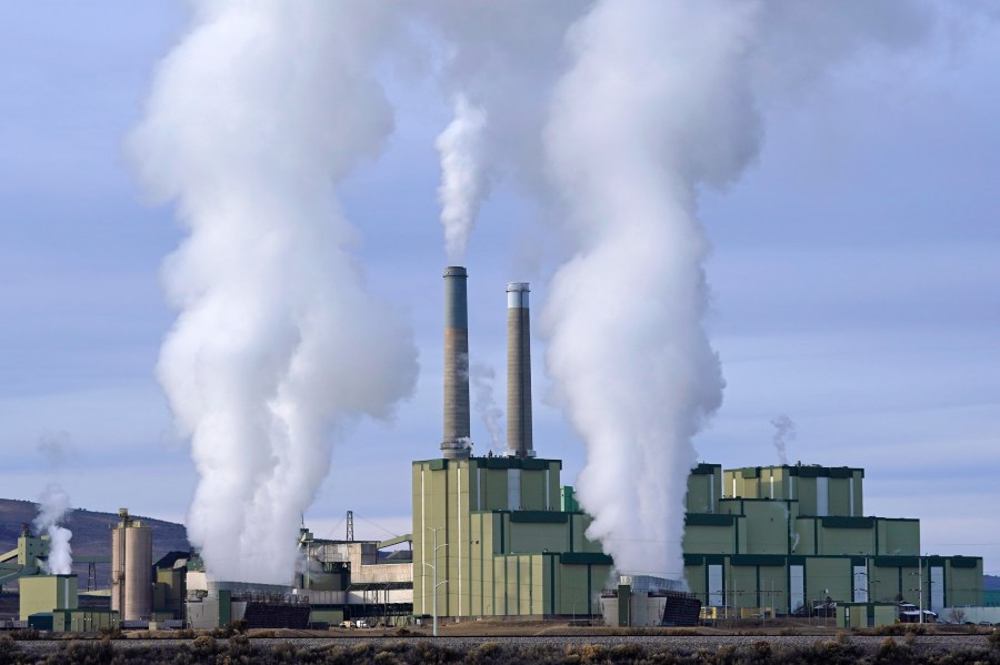 FILE - Steam billows from a coal-fired power plant Nov. 18, 2021, in Craig, Colo. A federal appeals court on Friday, July 19, 2024, allowed a Biden administration rule aimed at limiting planet-warming pollution from coal-fired power plants to remain in place, even as legal challenges continue. The EPA rule, announced in April, would force many coal-fired power plants to capture 90% of their carbon emissions or shut down within eight years. (AP Photo/Rick Bowmer, File)