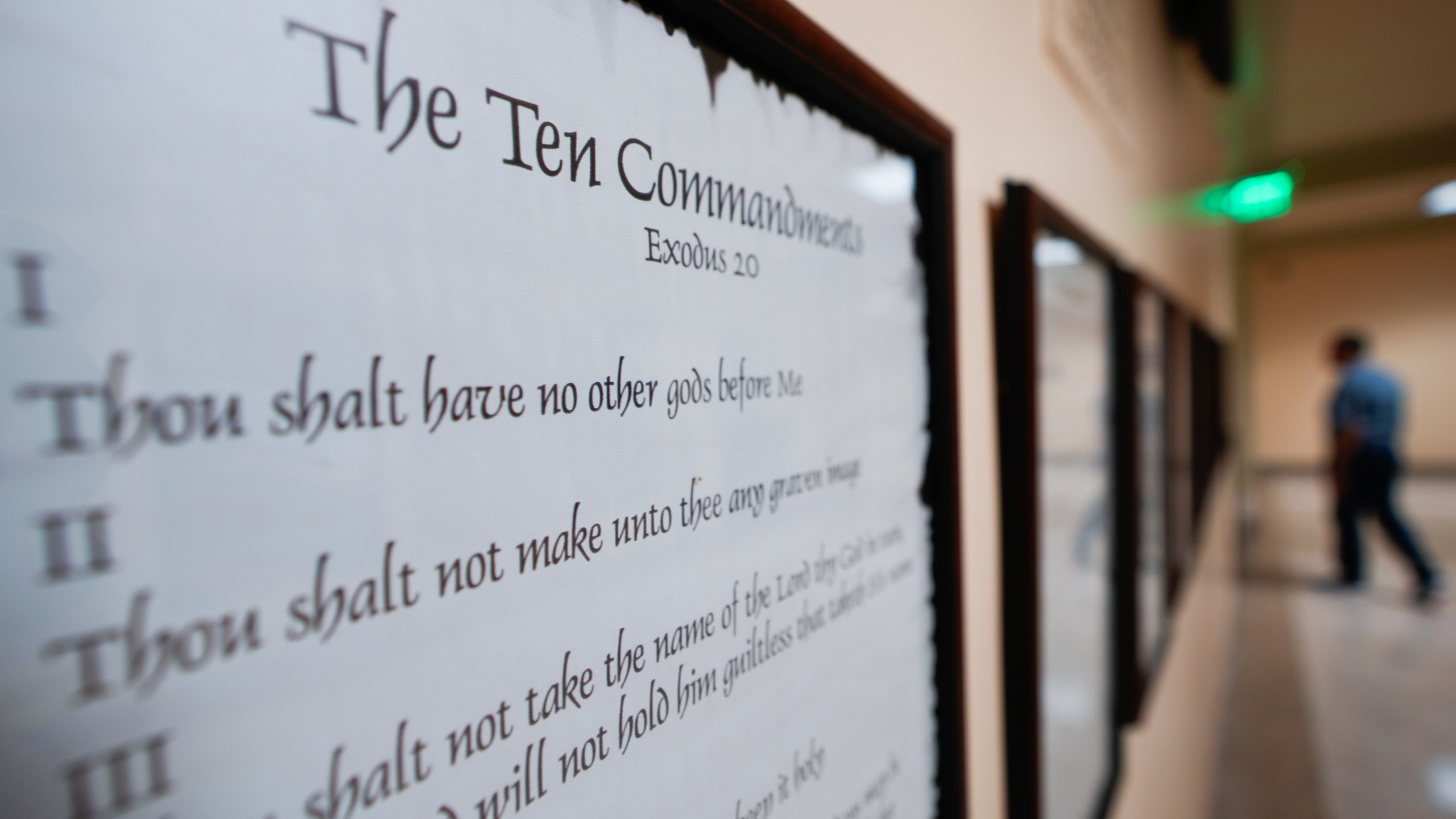 FILE - A copy of the Ten Commandments is posted along with other historical documents in a hallway of the Georgia Capitol, Thursday, June 20, 2024, in Atlanta. In motions filed Monday, July 8, 2024, parents challenging a new Louisiana law requiring that the Ten Commandments be posted in public school classrooms are asking a federal court to block implementation of it while their lawsuit progresses — and before the new school year starts. (AP Photo/John Bazemore, File)