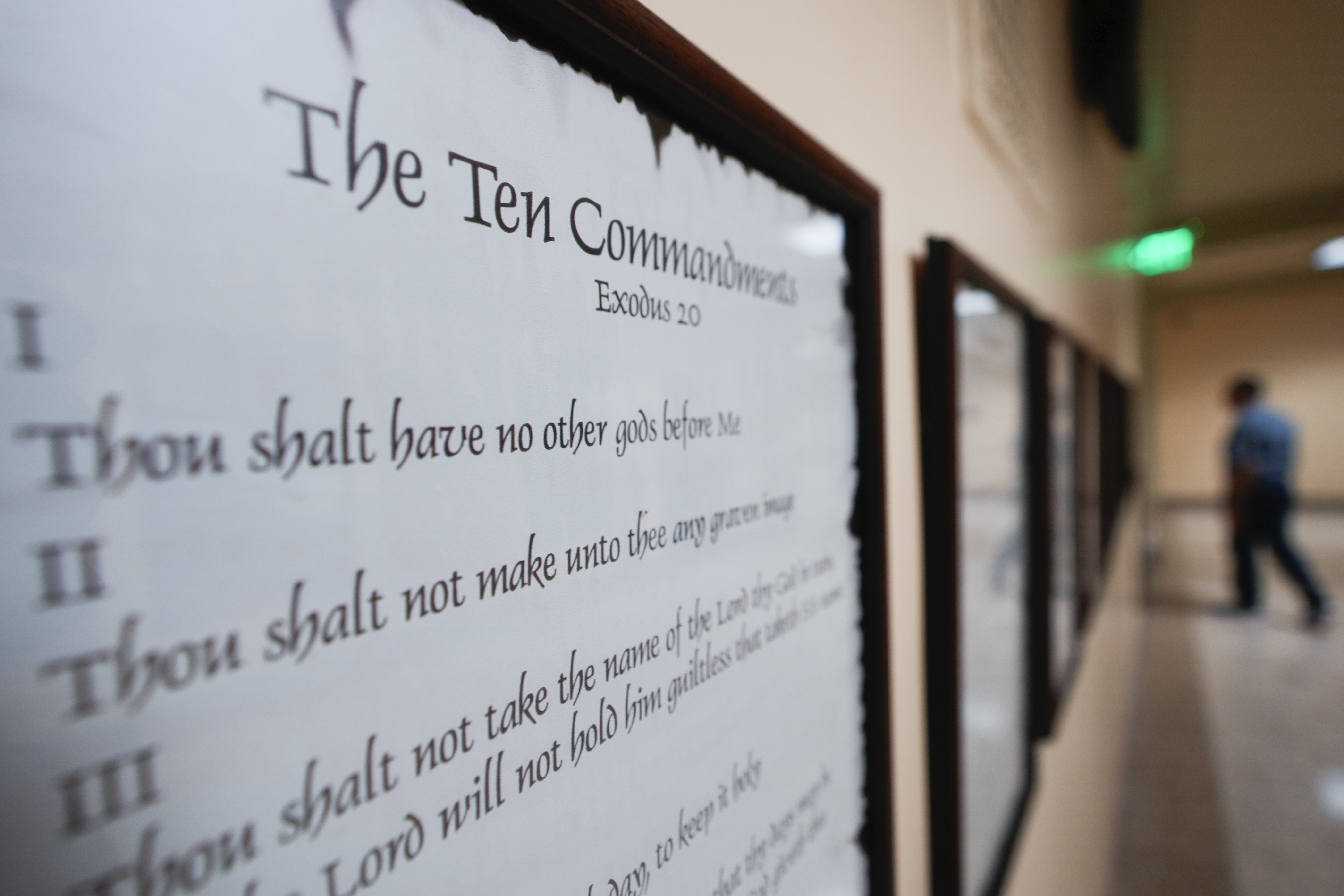 FILE - A copy of the Ten Commandments is posted along with other historical documents in a hallway of the Georgia Capitol, Thursday, June 20, 2024, in Atlanta. In motions filed Monday, July 8, 2024, parents challenging a new Louisiana law requiring that the Ten Commandments be posted in public school classrooms are asking a federal court to block implementation of it while their lawsuit progresses — and before the new school year starts. (AP Photo/John Bazemore, File)