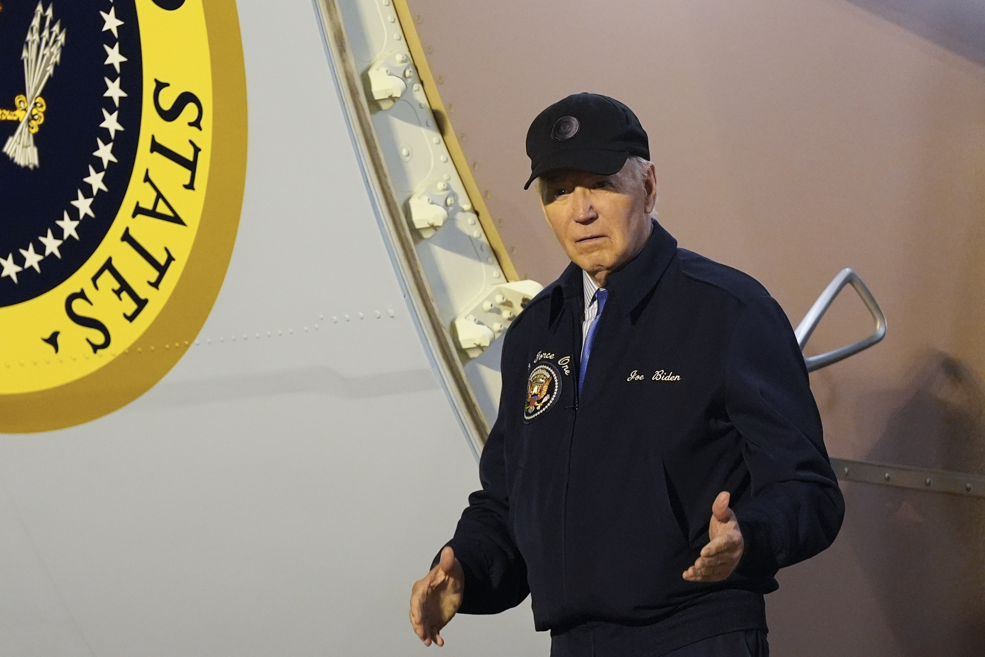 President Joe Biden walks down the steps of Air Force One at Dover Air Force Base in Delaware, Wednesday, July 17, 2024. Biden is returning to his home in Rehoboth Beach, Del., to self-isolate after testing positive for COVID-19. (AP Photo/Susan Walsh)