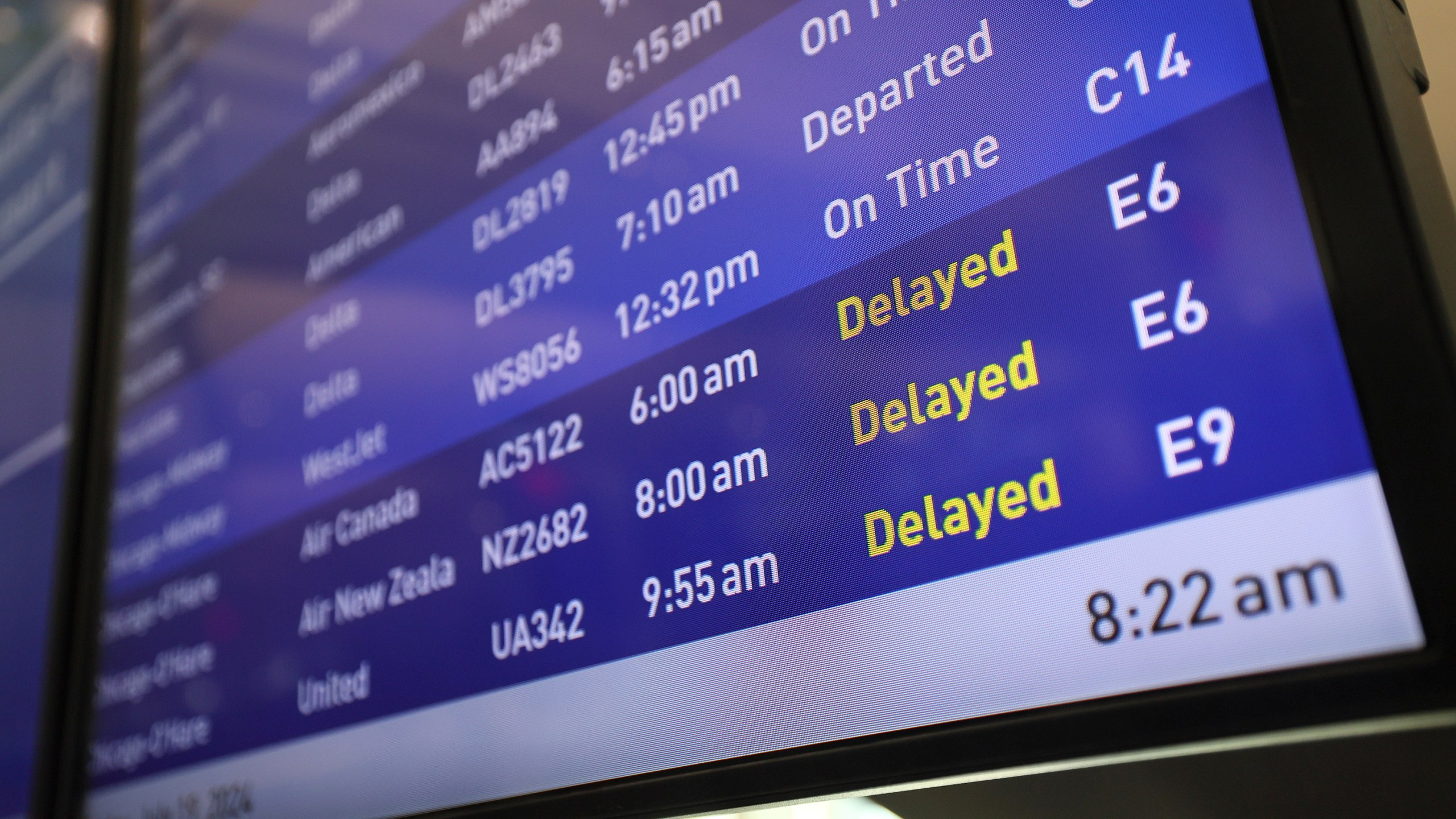 Flight boards show delayed or canceled flights at Minneapolis/St. Paul International airport after software issues delayed flights globally, Friday, July 19, 2024, in Minneapolis. (AP Photo/Adam Bettcher)