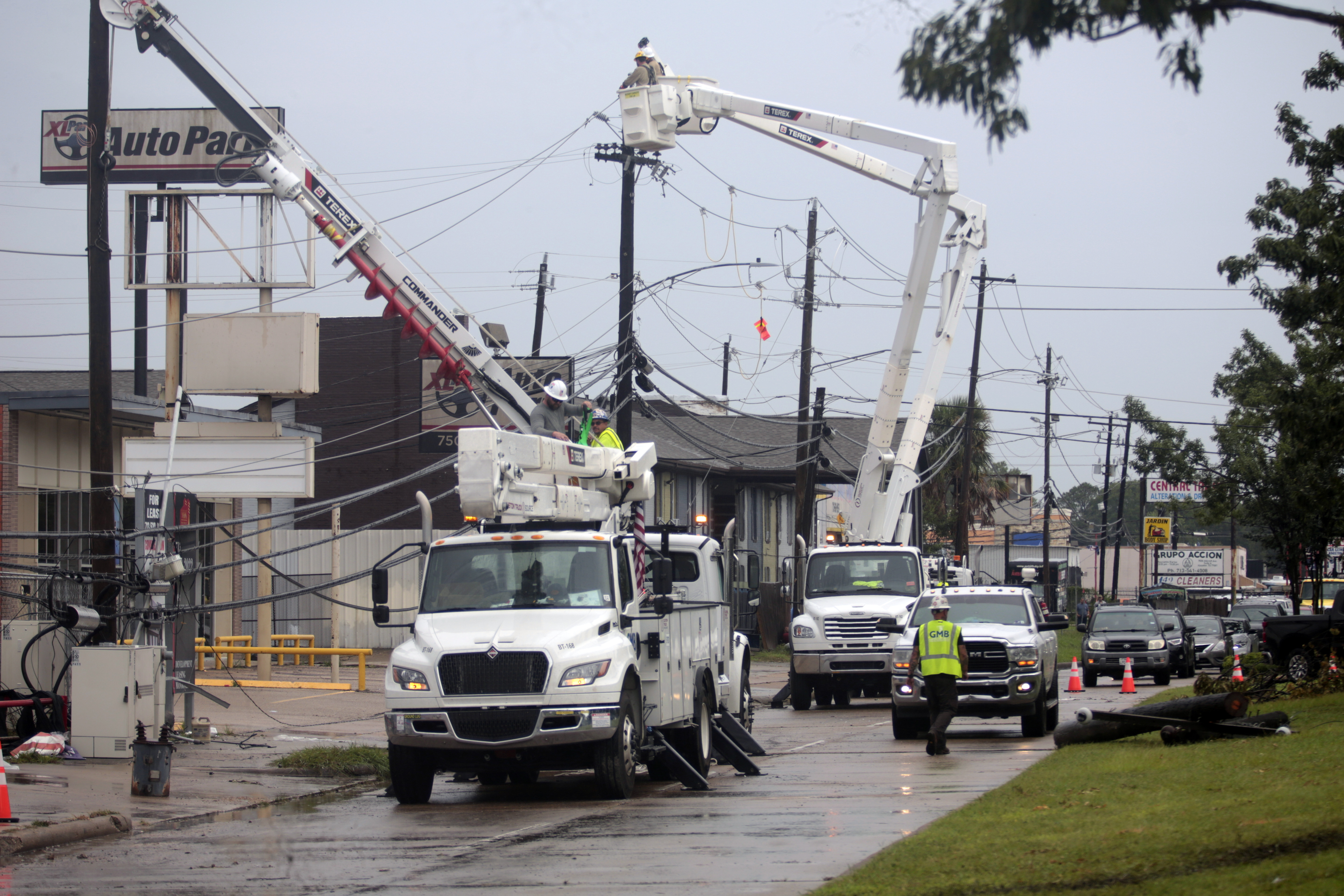 FILE - Utility crews work to restore electricity in Houston, Thursday, July 11, 2024. As of Thursday, July 18, most Houston residents finally had electricity after more than a week of widespread outages. (AP Photo/Lekan Oyekanmi, File)