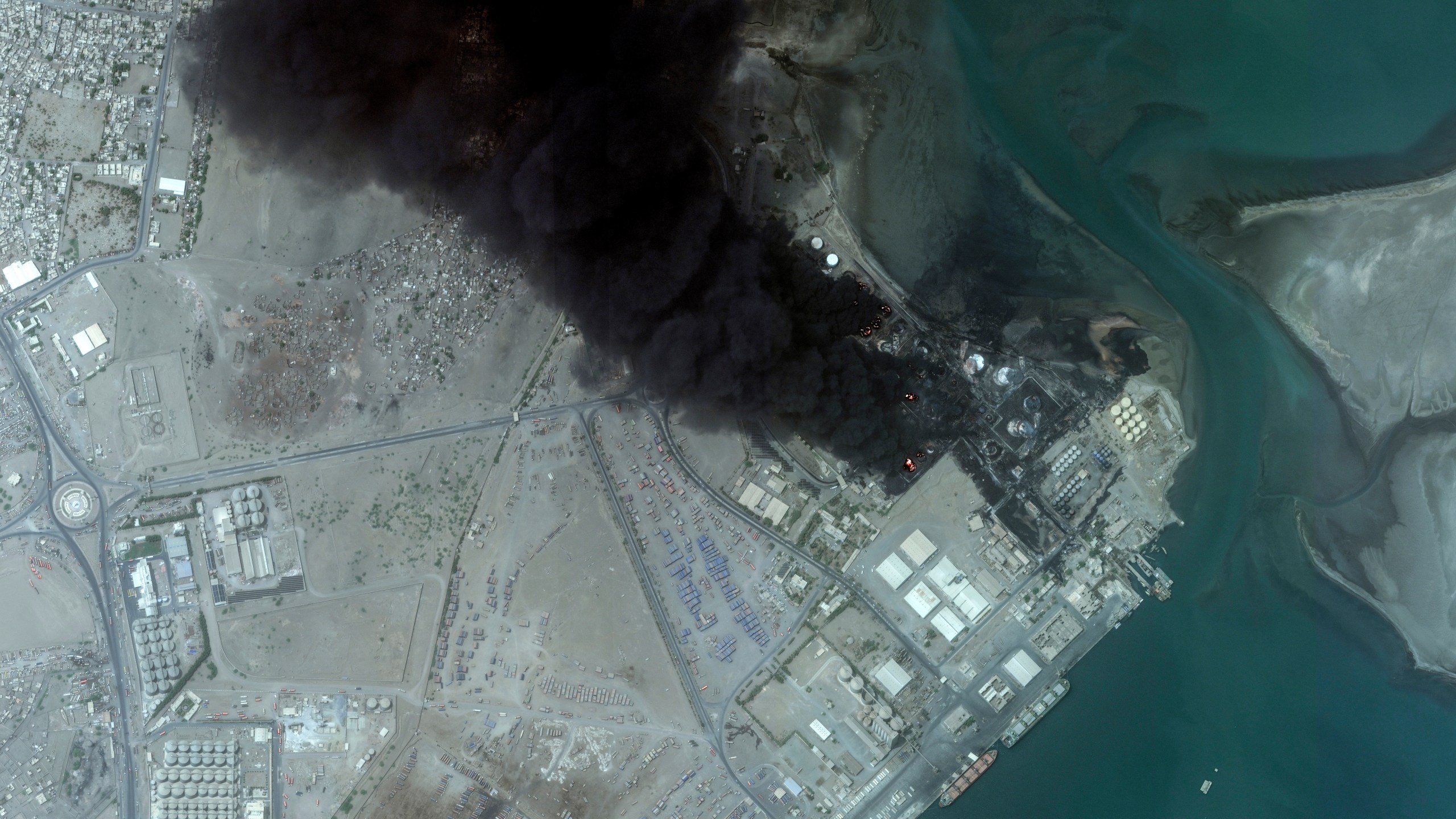 This satellite image provided by Maxar Technologies shows an overview of burning oil tanks in Hodeidah, Yemen, July 21, 2024. (Satellite image ©2024 Maxar Technologies via AP)