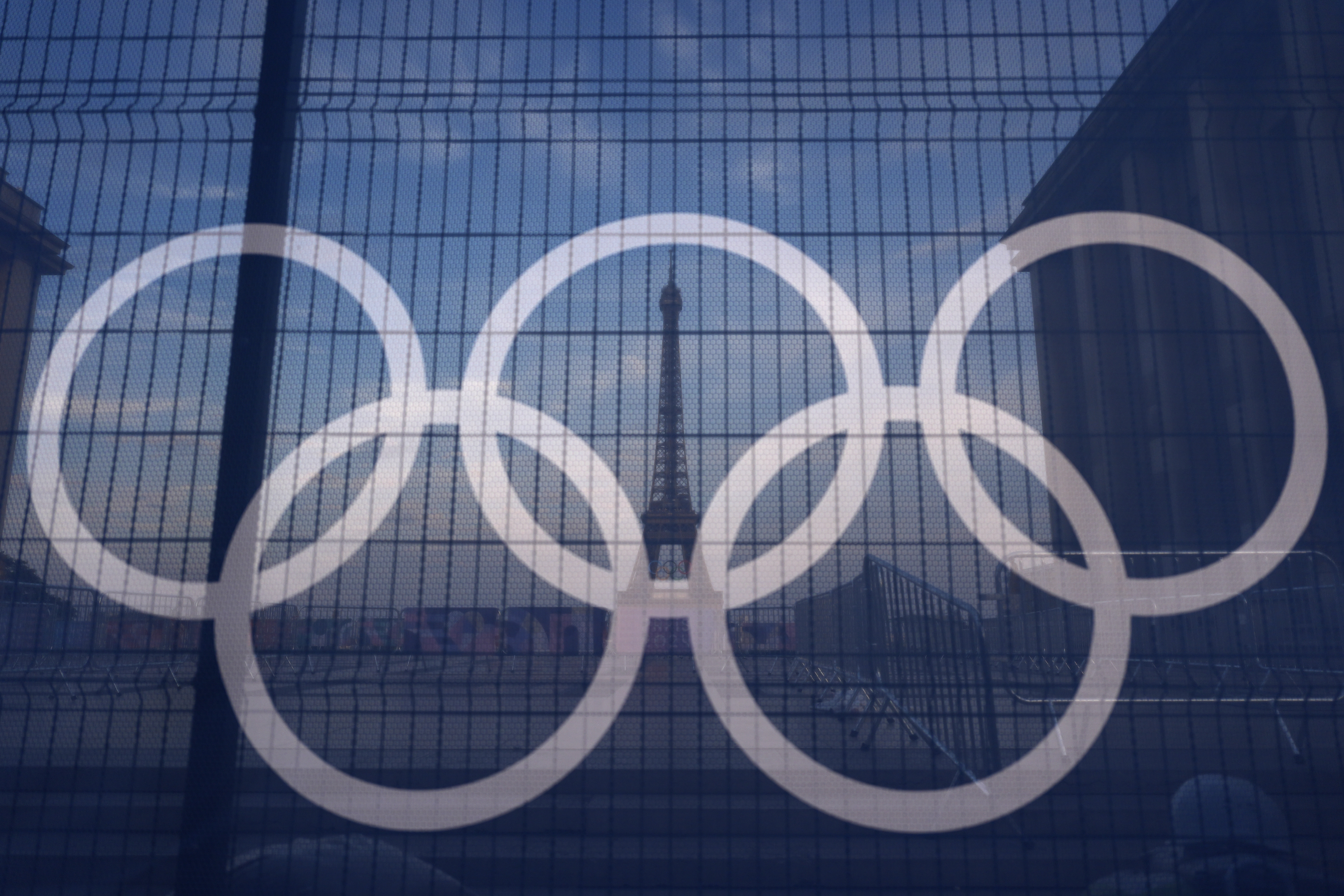 FILE - The Eiffel Tower is seen behind the Olympic rings, at the Trocadero plaza Thursday, July 18, 2024 in Paris. (AP Photo/David Goldman, File)