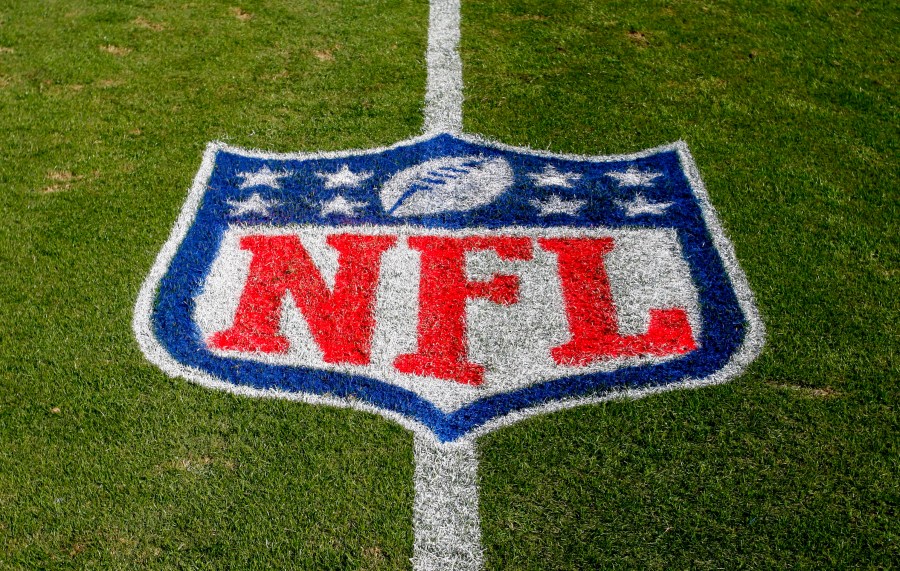 FILE - The NFL logo is displayed on the field at the Bank of American Stadium, Nov. 4, 2018, in Charlotte, N.C. The judge who presided in the class-action lawsuit filed by “Sunday Ticket” subscribers against the NFL said the jury did not follow his instructions in determining damages. (AP Photo/Nell Redmond, File)