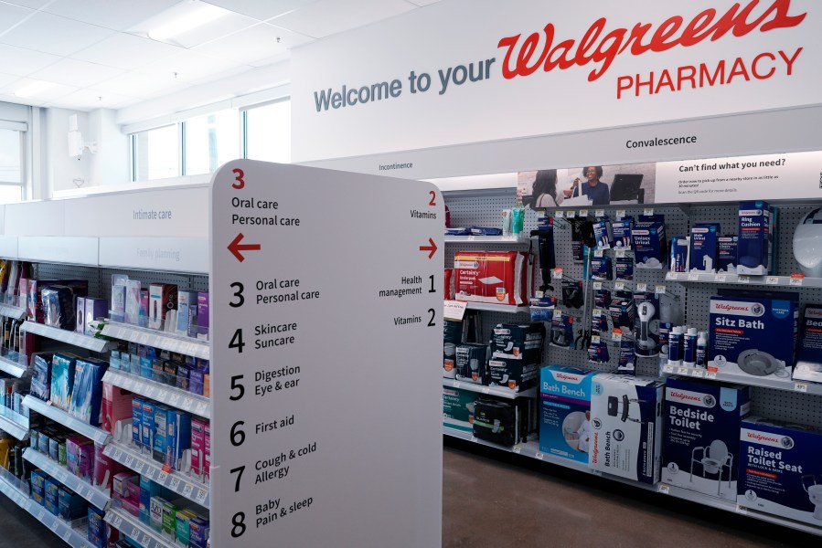 Aisle information signs are seen at a Walgreens pharmacy store in Deerfield, Ill., Thursday, July 25, 2024. (AP Photo/Nam Y. Huh)