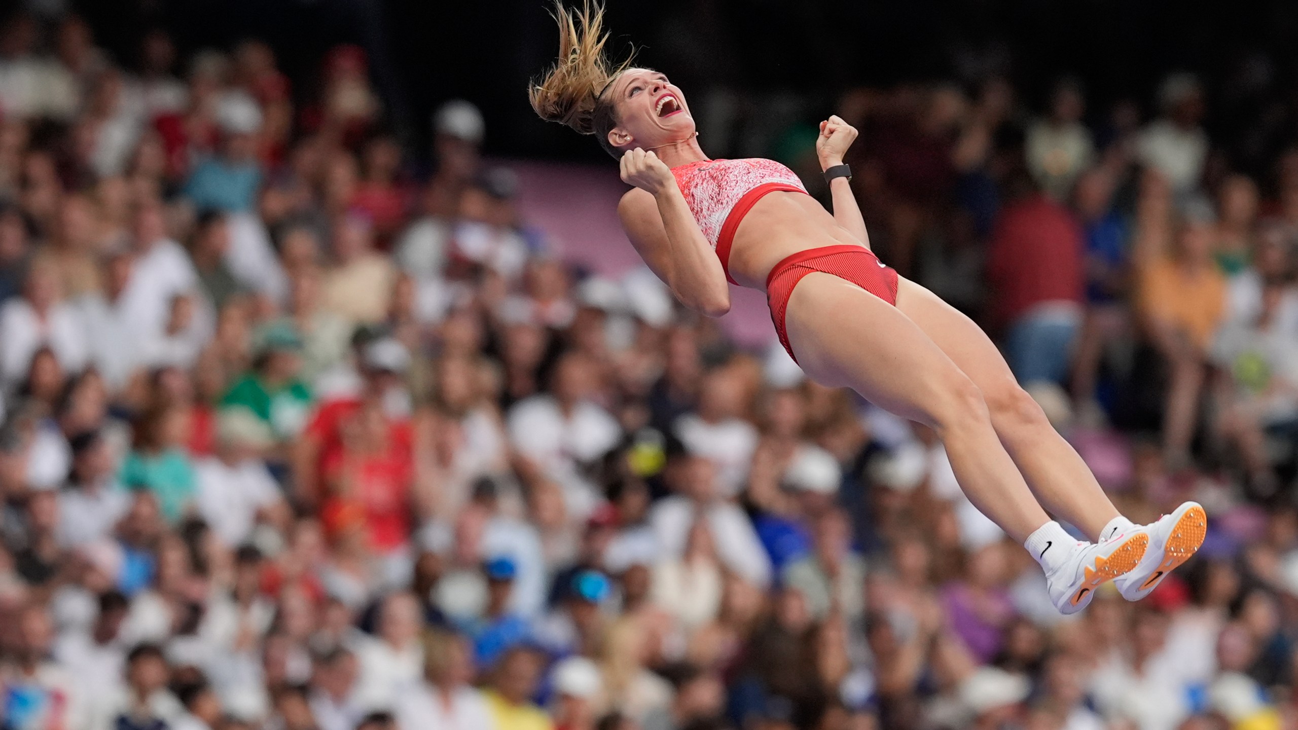 FILE - Alysha Newman, of Canada, celebrates a successful vault as she competes in the women's pole vault final at the 2024 Summer Olympics, Wednesday, Aug. 7, 2024, in Saint-Denis, France. (AP Photo/Rebecca Blackwell, File)