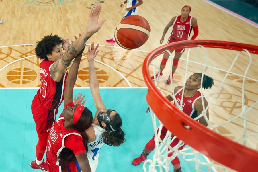 United States' Brittney Griner, left, (15) and United States' Kahleah Copper (7) block a shot form Sarah Michel Boury, right, (10), of France, during a women's gold medal basketball game between the United States and France at Bercy Arena at the 2024 Summer Olympics, Sunday, Aug. 11, 2024, in Paris, France. (Gregory Shamus/Pool Photo via AP)