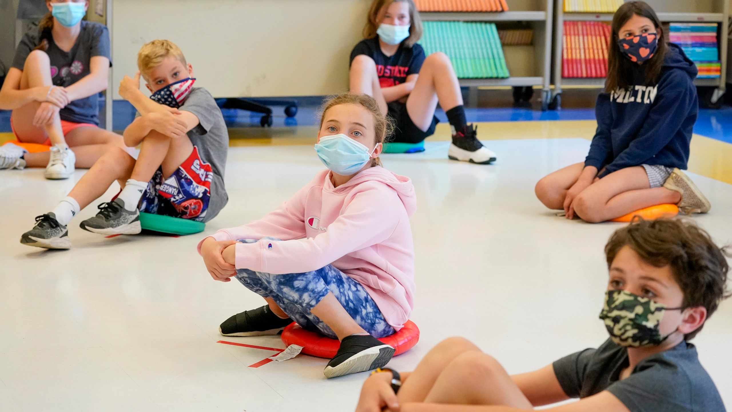 FILE - Fifth graders wearing face masks are seated at proper social distancing during a music class at the Milton Elementary School in Rye, N.Y., May 18, 2021. (AP Photo/Mary Altaffer, File)