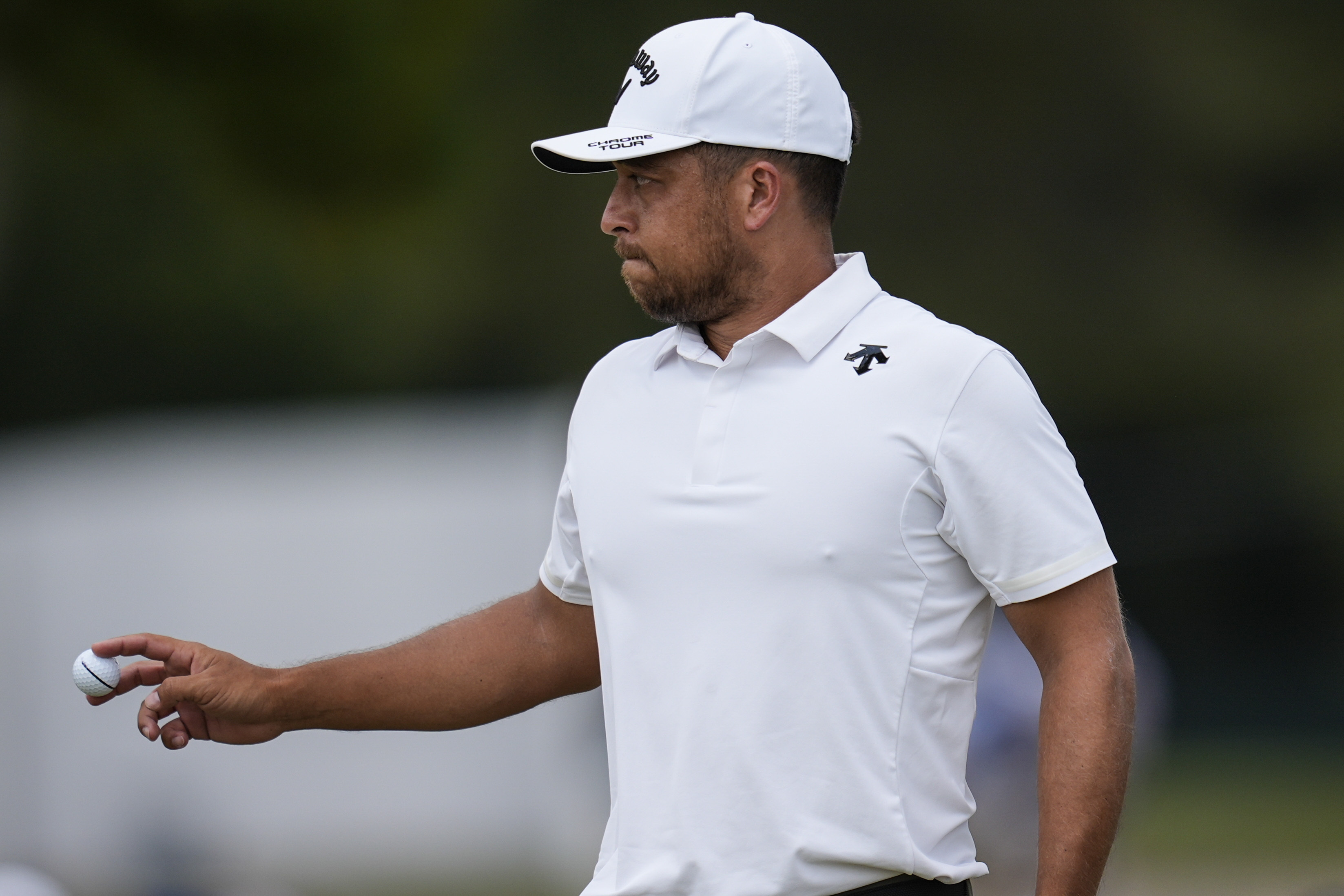 Xander Schauffele walks on the seventh green during the second round of the Tour Championship golf tournament, Friday, Aug. 30, 2024, in Atlanta. (AP Photo/Mike Stewart)