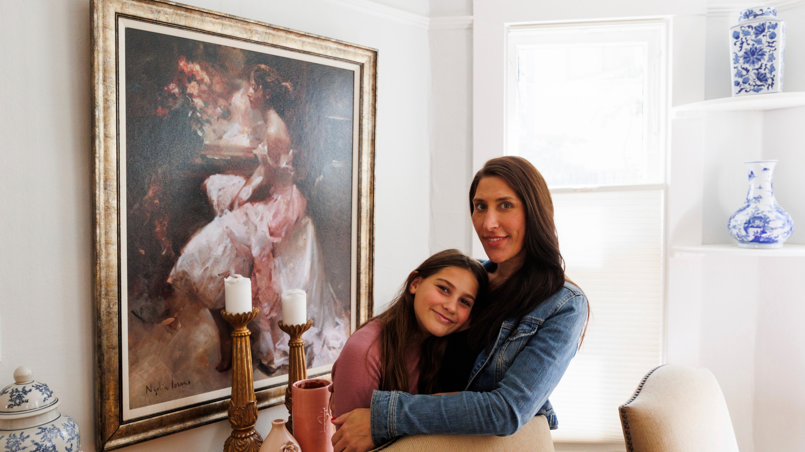 Scarlett Goddard Strahan, 11, and her mom Anna Goddard pose for a portrait at their home on Tuesday, Aug. 20, 2024, in Sacramento, Calif. (AP Photo/Juliana Yamada)