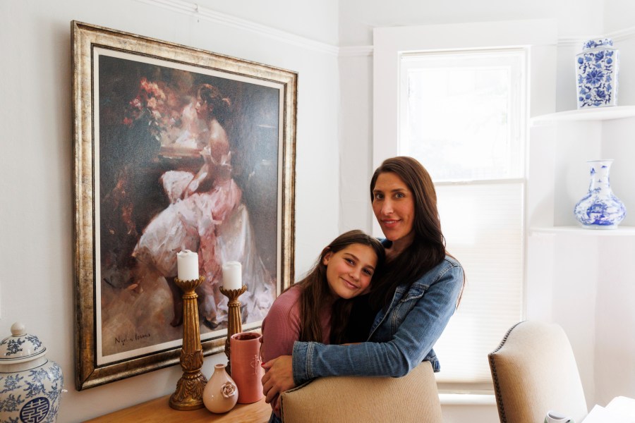 Scarlett Goddard Strahan, 11, and her mom Anna Goddard pose for a portrait at their home on Tuesday, Aug. 20, 2024, in Sacramento, Calif. (AP Photo/Juliana Yamada)