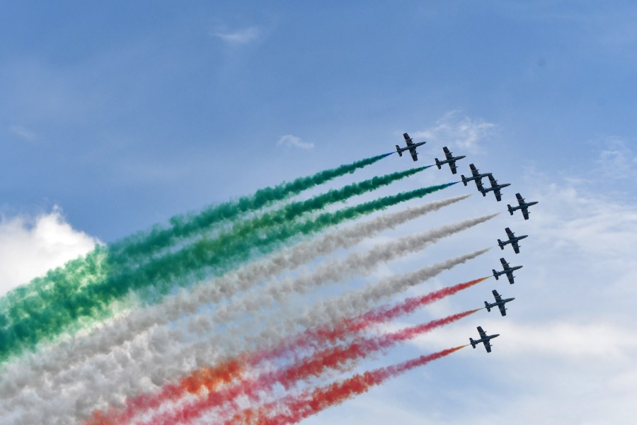 The Italian Air Force's Freece Tricolori perform with their red, white and green smoke. Photo by Ricky Matthews.