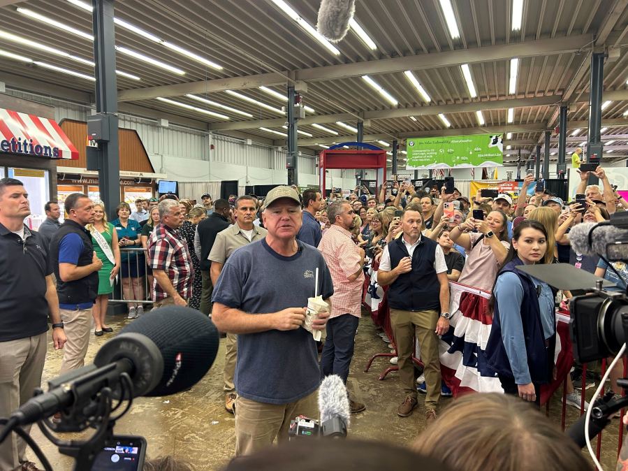 Democratic vice presidential candidate Minnesota Gov. Tim Walz speaks to a crowd gathered at the Dairy building during his visit at the Minnesota State Fair in Falcon Heights, Minn., Sunday, Sept. 1, 2024. (Clay Masters/Minnesota Public Radio via AP)