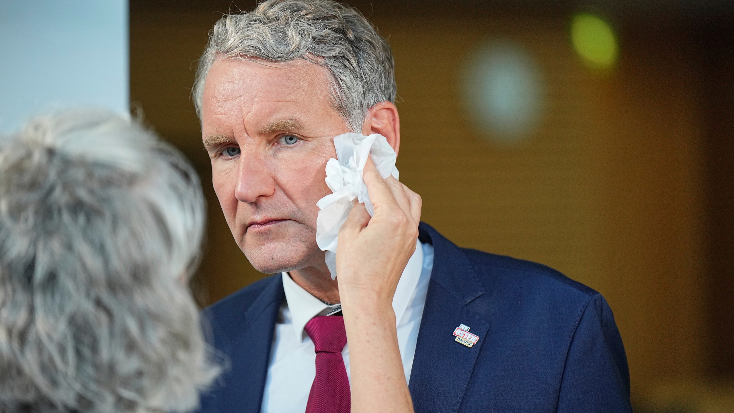 Bjoern Hoecke, top candidate in Thuringia of the far-right Alternative for Germany, prepares for an interview during the state election for Thuringia, in Erfurt, Germany, Sunday, Sept. 1, 2024. (Michael Kappeler/dpa via AP)