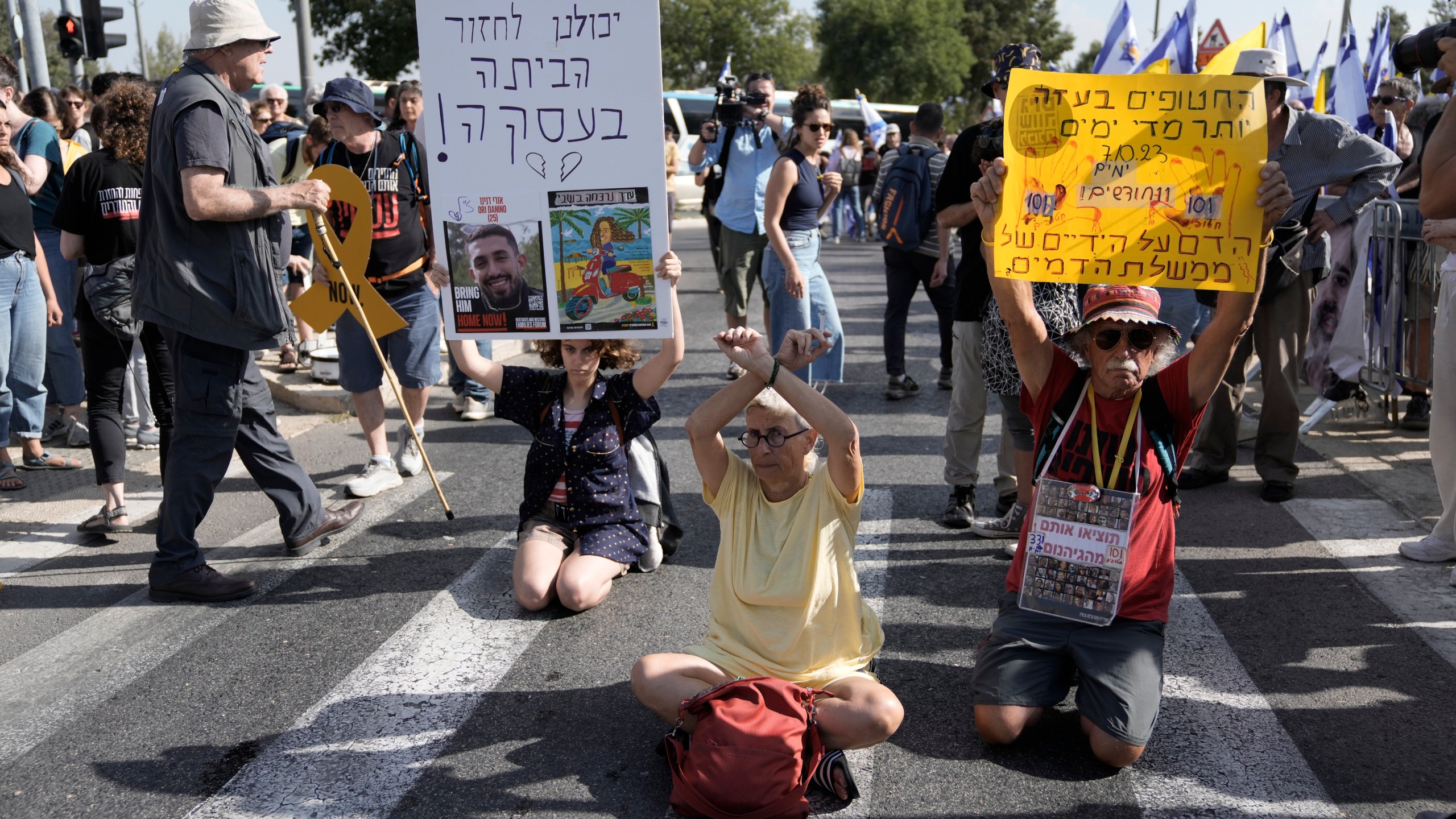 People take part in a protest to call for the immediate release of hostages held in the Gaza Strip by the Hamas militant group in Jerusalem, Sunday, Sept. 1, 2024. (AP Photo/Mahmoud Illean)