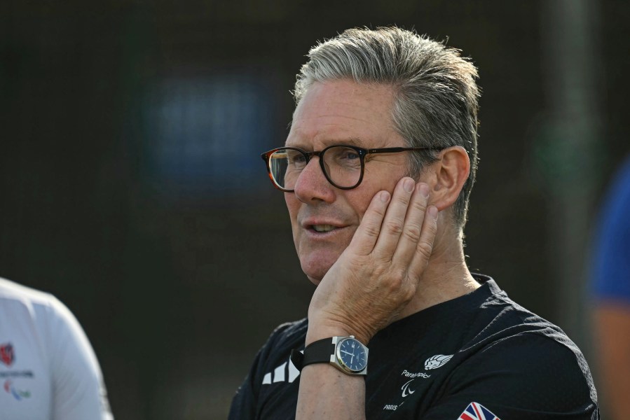 Britain's Prime Minister Keir Starmer reacts as he visits a training centre in Saint-Germain-en-Laye, northwest of Paris, Thursday, Aug. 29, 2024, amid the Paris 2024 Paralympic Games. (Justin Tallis/Pool Photo via AP)