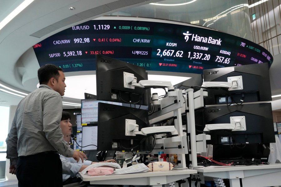 FILE - Currency traders watch monitors at the foreign exchange dealing room of the KEB Hana Bank headquarters in Seoul, South Korea, on Aug. 29, 2024. (AP Photo/Ahn Young-joon, File)