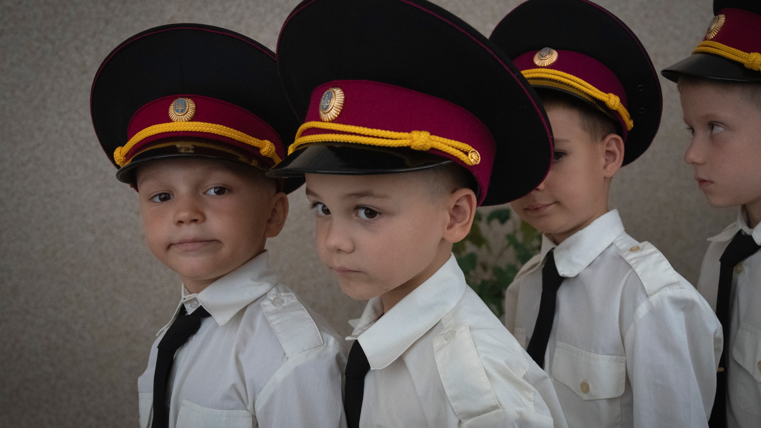 Young cadets get ready for a ceremony in a cadet lyceum on the first day at school in Kyiv, Ukraine, Monday, Sept. 2, 2024. Children and students went to school despite the fact that Kyiv was hit by massive Russian missile barrage early in the morning, causing fires, damaged buildings and infrastructure objects. (AP Photo/Efrem Lukatsky)