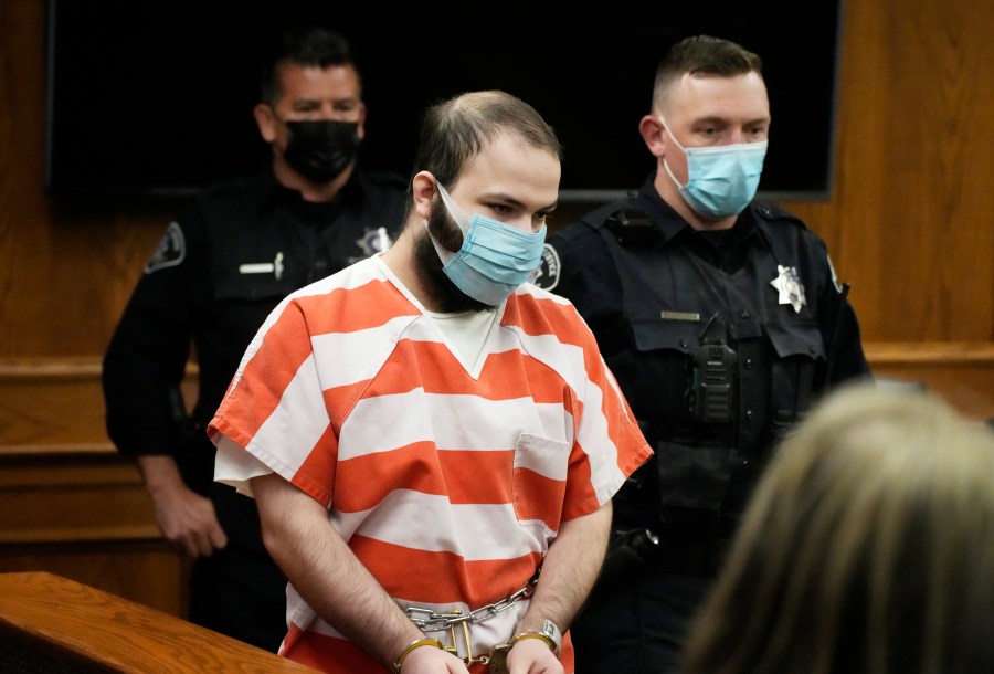 FILE - Ahmad Al Aliwi Alissa, accused of killing 10 people at a Colorado supermarket in March 2021, is led into a courtroom for a hearing, Sept. 7, 2021, in Boulder, Colo. (AP Photo/David Zalubowski, Pool, File)